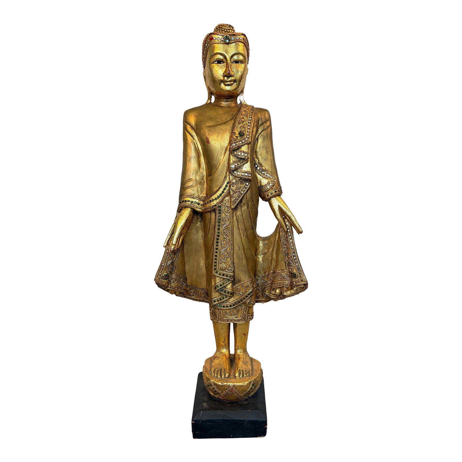 Early 20th Century Burmese Mandalay Standing Gilt Wood Buddha Sculpture: Gracefully standing over thirty-three inches in height, this finely hand-carved Burmese Mandalay Buddha possesses a commanding architectural presence while maintaining the serene elegance
