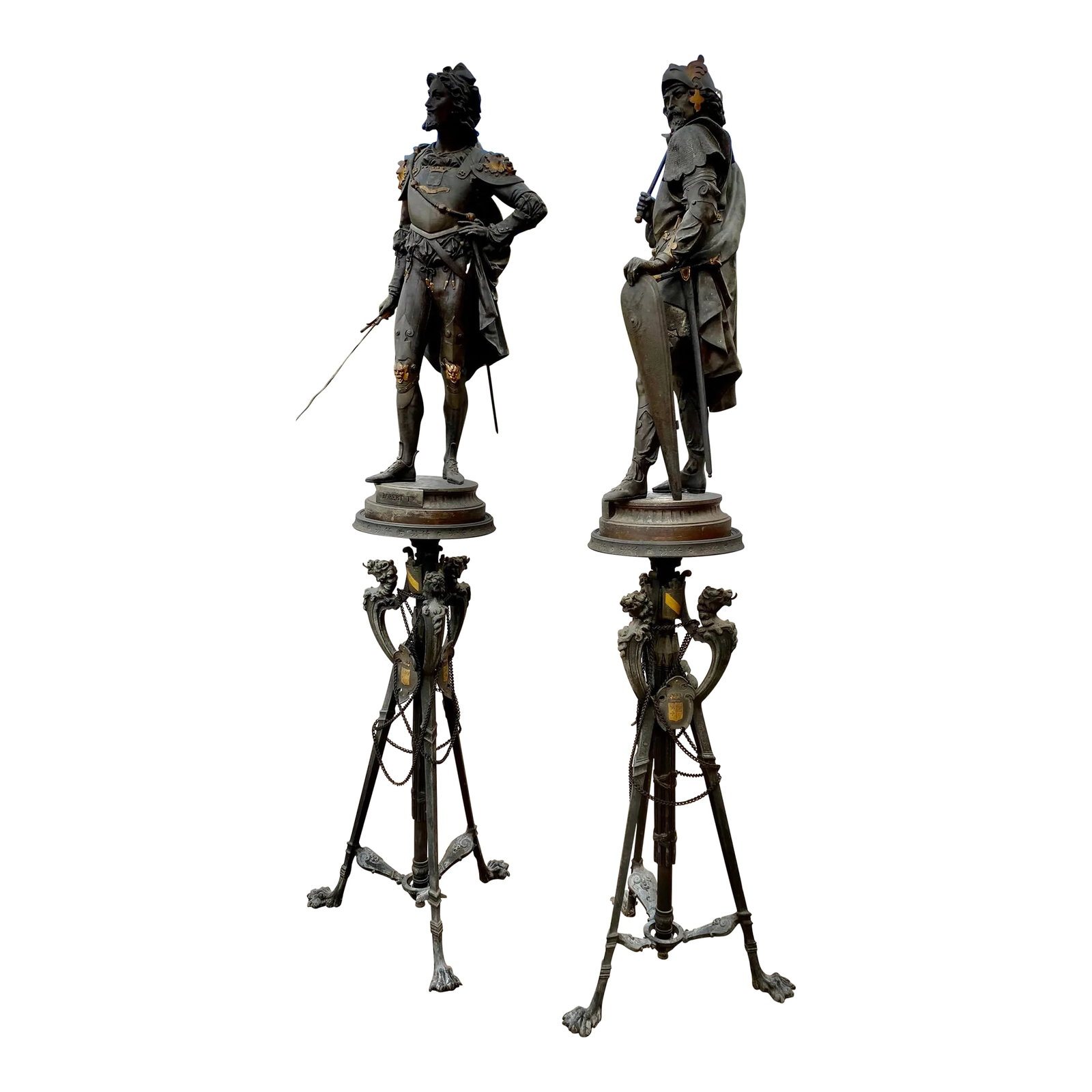 Pair of Late 19th Century Palatial Spelter Medieval Statues Roland & Robert I on Stands: This is an amazing pair of detailed spelter medieval military figures on wonderful bases with dragon heads. The figures are titled Roland and Robert 1 and are completely adorned with their costumes