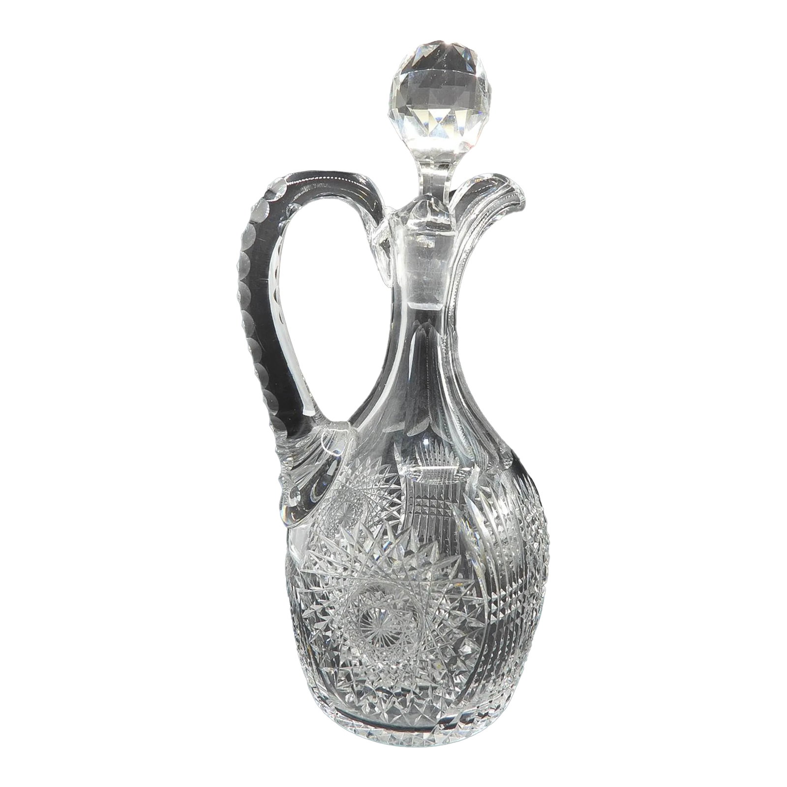 Early 20th Century Brilliant Cut Crystal Wine Decanter Carafe Mars Pattern 1907: This marvelous American Brilliant cut crystal decanter is created with a substantial handle which has intricate cuts to facilitate grip and a gracious spout to facilitate a clean pour. The beautiful