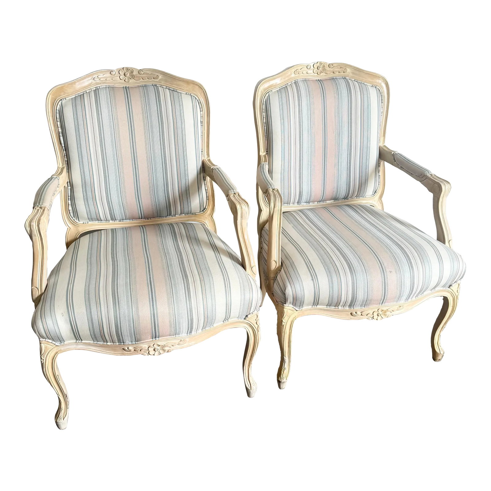 French Provincial Blonde With Blue and Pink Striped Fabric Arm Chairs - a Pair: Add a touch of elegance to your space with this pair of French Provincial armchairs. Featuring a beautifully carved blonde wood frame and soft blue and pink striped upholstery, these chairs evoke