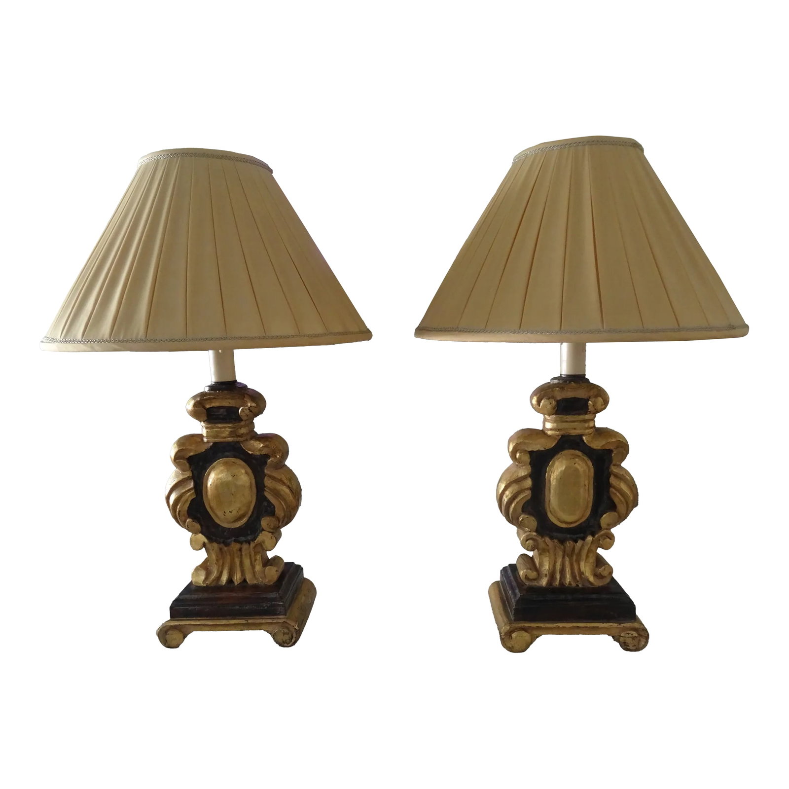 Vintage Italian Carved Wood and Parcel Gilt Lamps - a Pair: A Beautiful pair of lamps carved on both the front and the back with custom lamp shades they are newly rewired. Condition: Alterations: Original Condition Unaltered Imperfections: Some Imperfections C