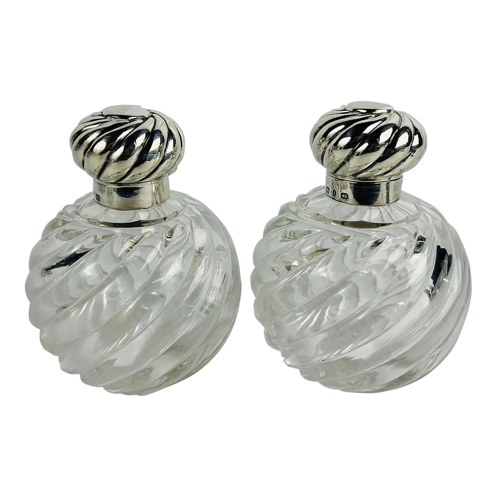 Pair, Horton & Allday Sterling Silver & Swirled Glass Perfume Bottles C. 1893: This exquisite pair of perfume bottles by Horton & Allday, crafted in 1893, combines the elegance of Victorian design with exceptional craftsmanship. The swirled glass bodies feature intricate,
