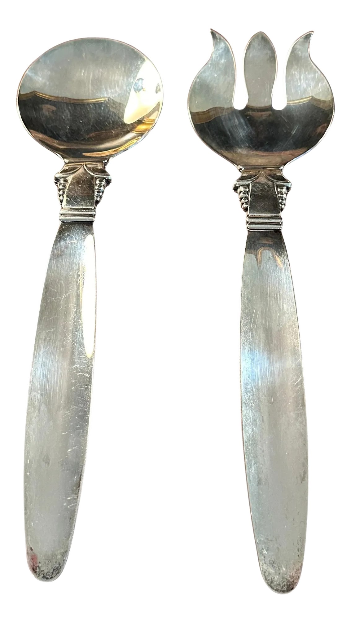 Mid 20th Century Jensen Style Serving Spoons- a Pair: A very impressive pair of Salad or Side Dish Servers in the style of George Jensen, the famous Danish Silver Smith. The serving pieces are large and practical for a Buffet Service. The detail on the