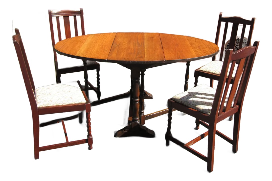 Classic English Dining Table & Set of Four English Solid-Oak Dining Chairs, With Barley Twist Legs a: A classic set of four English solid-oak dining chairs, with barley twist legs and drop-in seats & dining table. This is sold as a set. Condition: Alterations: Restored Imperfections: Some Imperfection