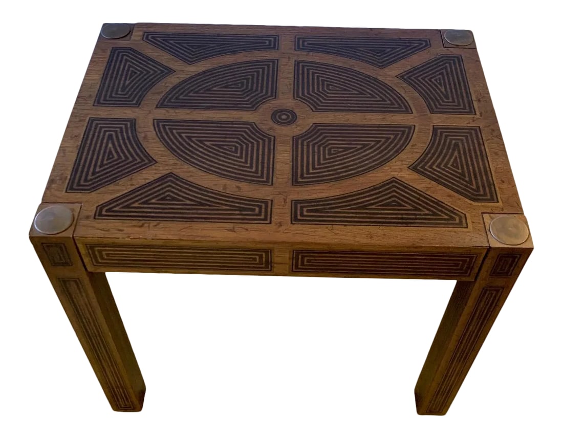 Inlaid Wood Rectangular End Table With Geometric Decoration: Handsome rectangular inlaid wood end table having stunning geometric design and brass medallions in each corner on top of square legs that are equally decorative. Condition: Alterations: Original