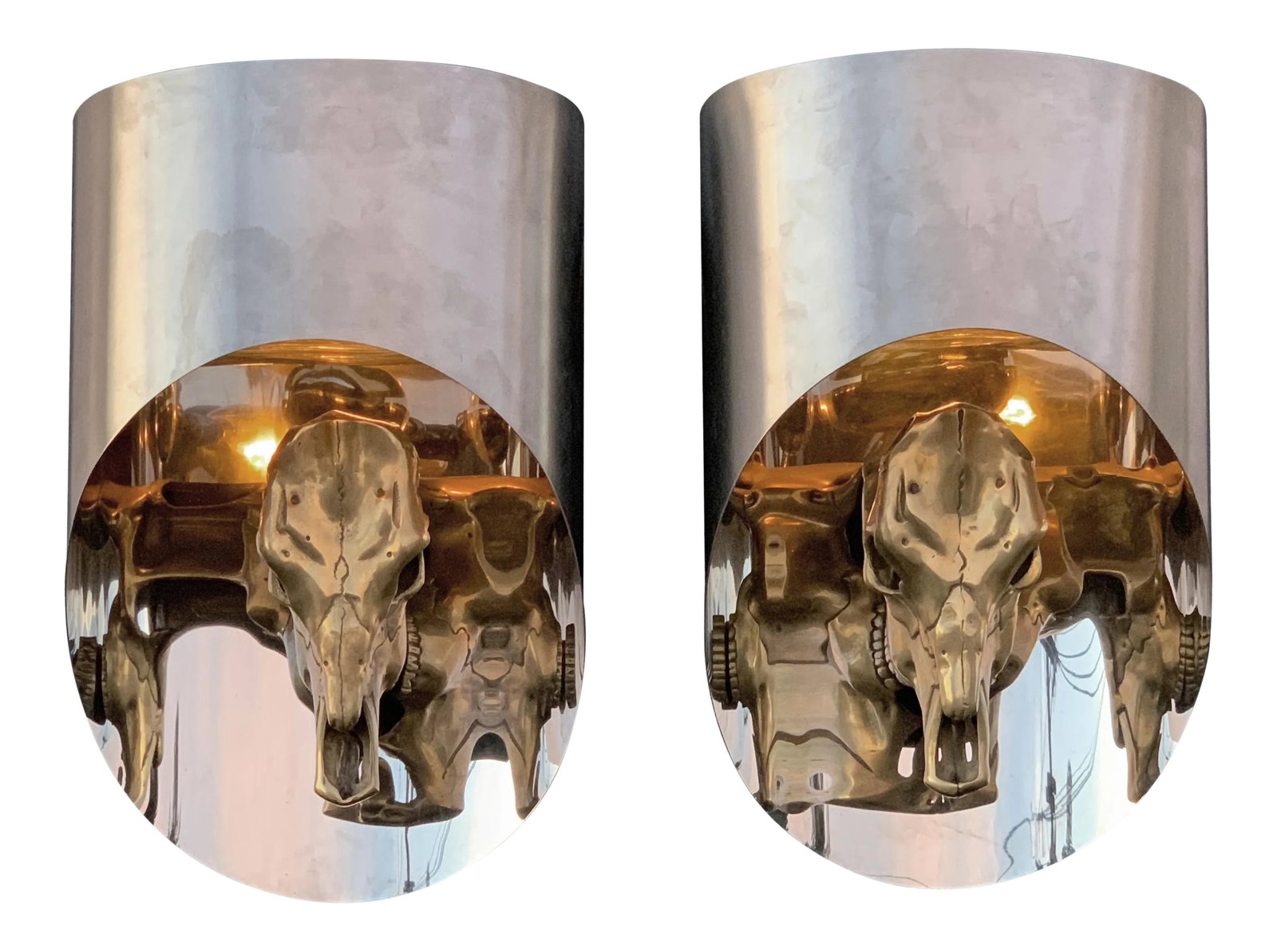 Totem Sconces Attributed to Maria Pergay - a Pair: Pair of "Totem" sconces attributed to Maria Pergay. Made of oval shaped stainless steel and brass ram skull. Inside is mirror polished and exterior is brushed finish. Rewired for USA. Requires one up 