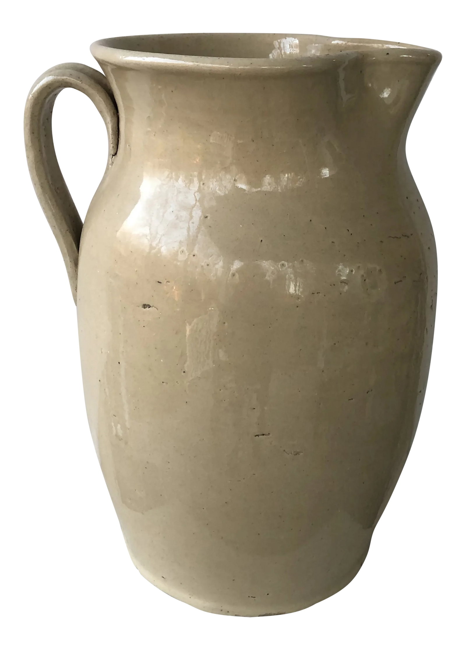 Mid 19th Century English Cream Glazed Pottery Pitcher: Amazingly large cream glazed English pottery pitcher. Great for flowers arrangements or as an umbrella stand. Condition: Alterations: Original Condition Unaltered Imperfections: Some Imperfections