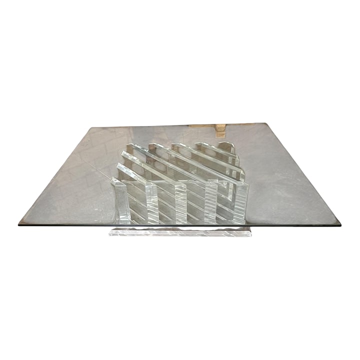 Lucite & Glass Top Coffee Table: Large rectangular coffee table with a clear Lucite base of angled supports and a thick beveled glass top. Designed in the style of Charles Hollis Jones, it reflects the clean lines and transparency