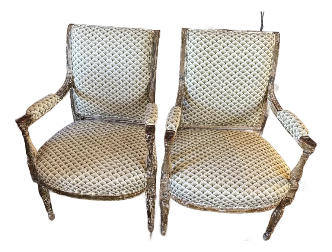 Pair of Antique French Louis XVI–Style Bergère Chairs, Green & White Striped Upholstery: Pair of antique French Louis XVI–style bergère chairs from the late 19th century, featuring carved, painted, and giltwood frames with delicate foliate and ribbon motifs and gently fluted