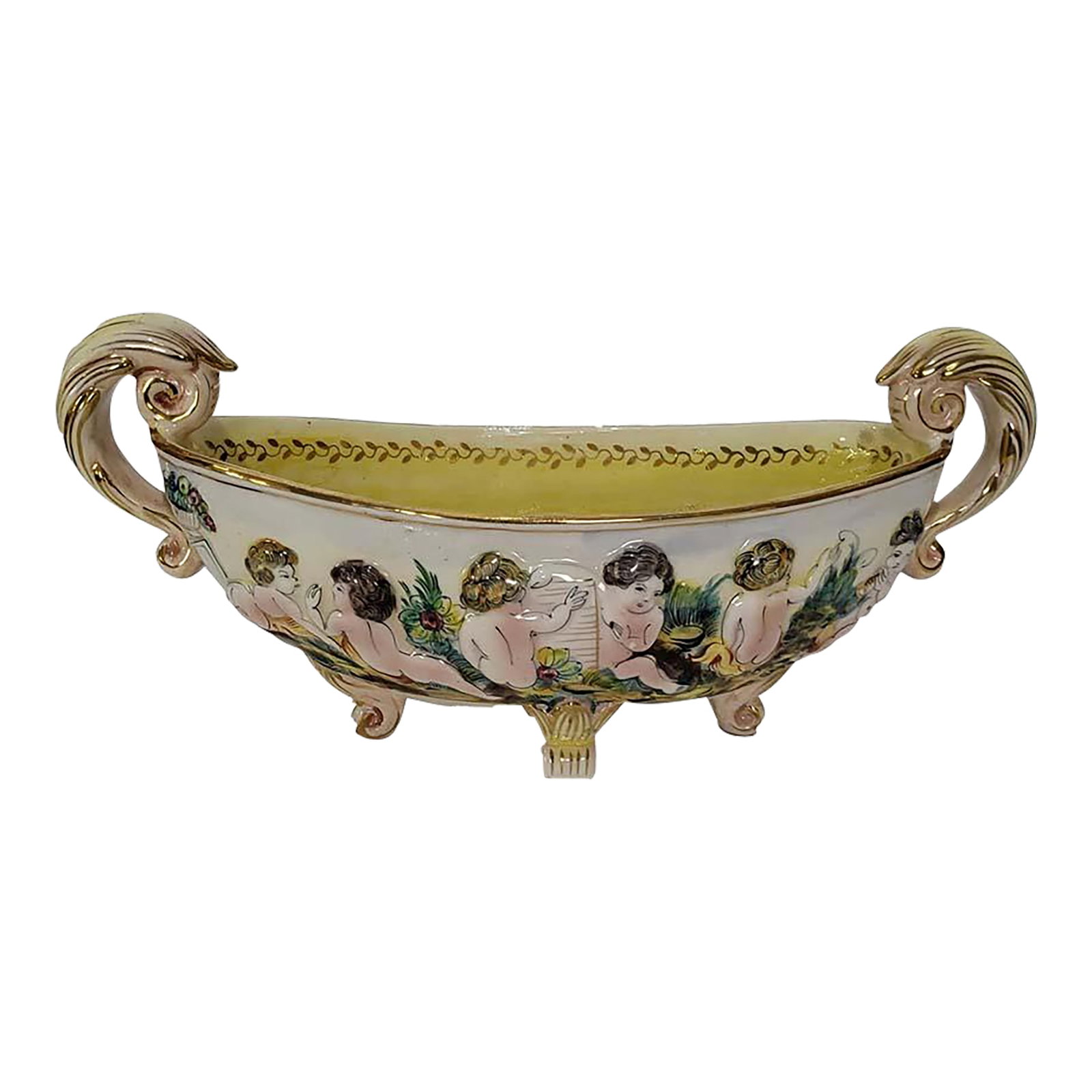 Capodimonte Centerpiece Bowl Cherubs Putti Playing - Made in Italy: Rare Capodimonte centerpiece bowl boasting raised porcelain cherubs/cupiids/putti playing, signed & numbered. Made in Italy Excellent condition Measurements: Handle to Handle 15", Bowl Only 14" Wide