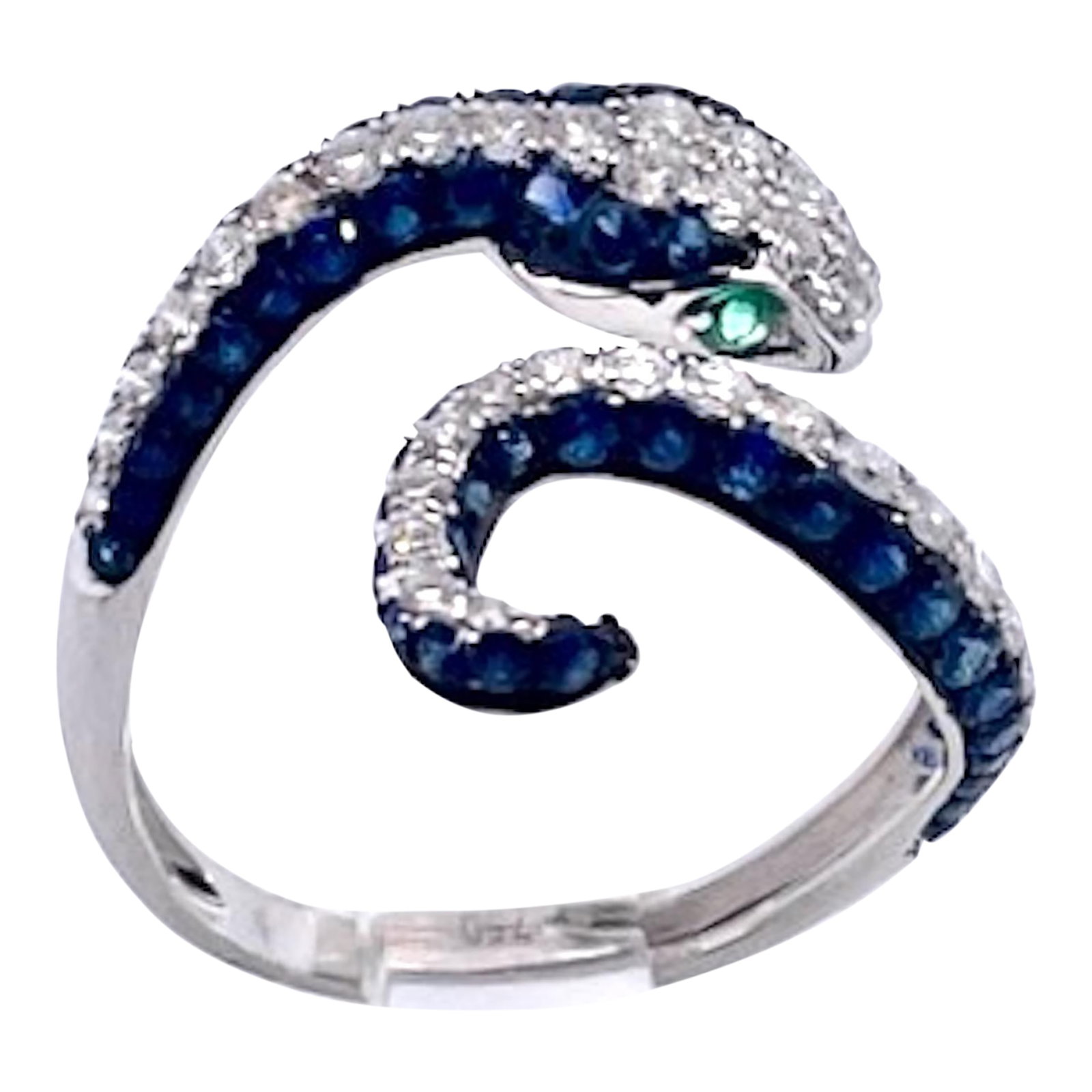 1990s Sapphire Diamond Snake Ring 18k, Size 6.5: This beautiful snake ring comes out of Barcelona Spain and it is stunning. This is a simple and delicate looking ring with a lot of punch. It is made of 18K White Gold with round brilliant Diamonds