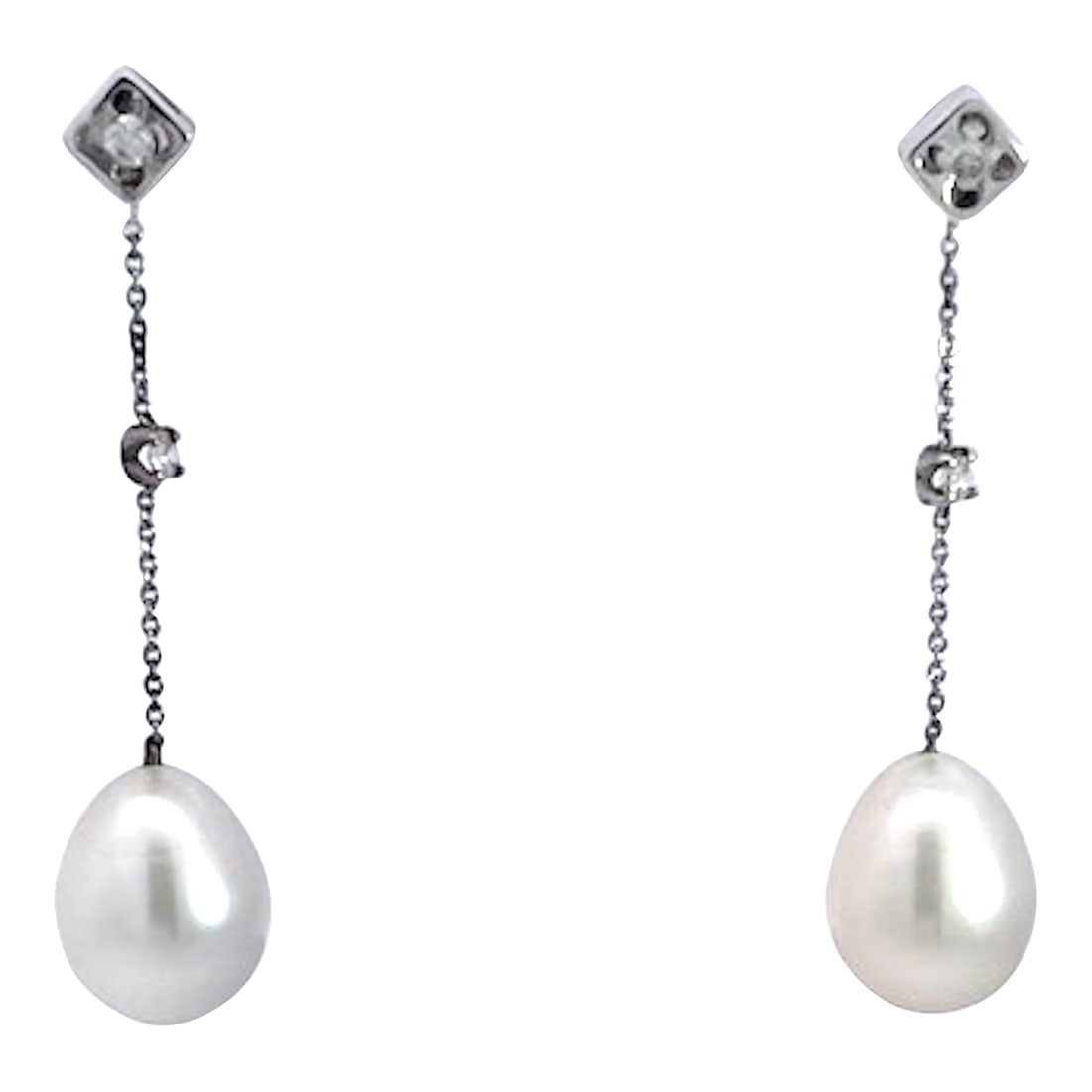 18k White Gold Pearl Drop Earrings, A Pair: These pearl earring are simple but that is what is needed sometimes. These earrings come out of the United Kingdom and are ready to wear. They are 1 1/2" long there are two single oval pearls and two