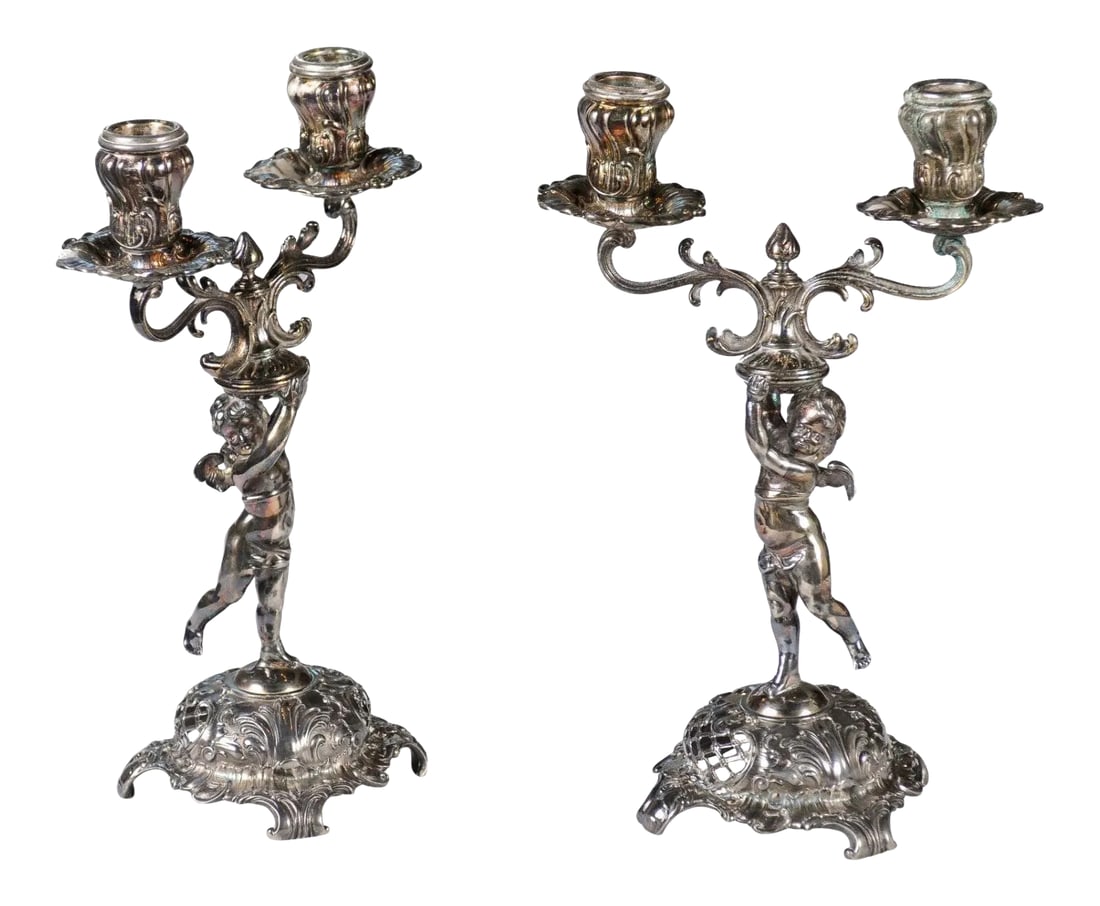 German Late 19th Century Jugendstil Silver Plated WMF Cherub Candelabras - A Pair: A pair of German Jugendstil late 19th century silver plated candelabras from the Wurtemberg Metalware Factory, with cherubs holding the bobèches. Born in Germany in the WÃ¼rttembergisch