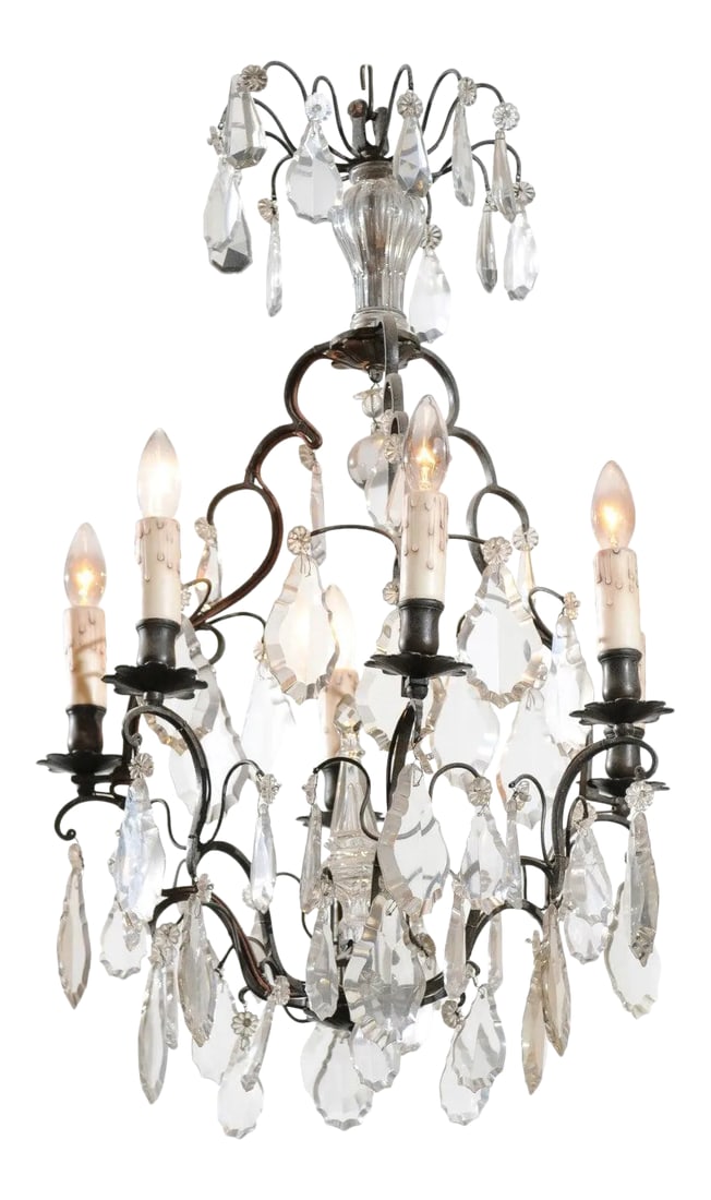 19th Century French Crystal Six-Light Chandelier with Iron Armature and Obelisk: A French six-light crystal chandelier from the 19th century, with iron armature and obelisk accent. Born in France during the politically dynamic 19th century, this French chandelier features an iron