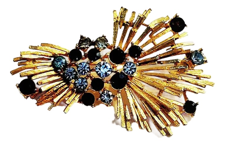 Lisner Starburst Spray Brooch With Blue Rhinestones - Signed: Vintage signed Lisner brooch stylized with a spray or gathered wheat design with prong-set stones and a bright gold tone finish. There are 2 shades of blue rhinestones, light and sapphire. This