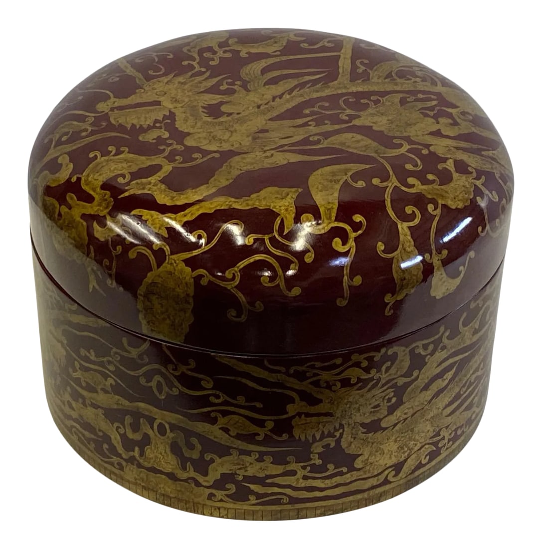 Maitland Smith Red Lacquer & Giltwood Box: Gorgeous round jewel of a red laquered lidded box having gold Asian inspired decoration with dragons and birds. Condition: Alterations: Original Condition Unaltered Imperfections: Some Imperfections C