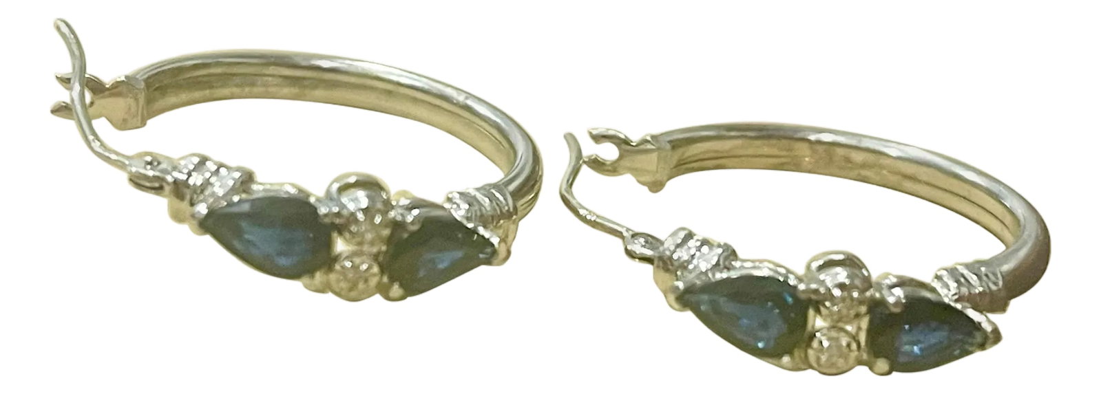Pear Shape Sapphire and Diamond Hoop Cocktail Earrings in 14 Karat White Gold: Pear Shape Sapphire & Diamond Hoop Cocktail Earrings in 14 Karat White Gold A fabulous pair of earrings with an enormous amount of look and sparkle! These exquisite pair of earrings features 4 Pear