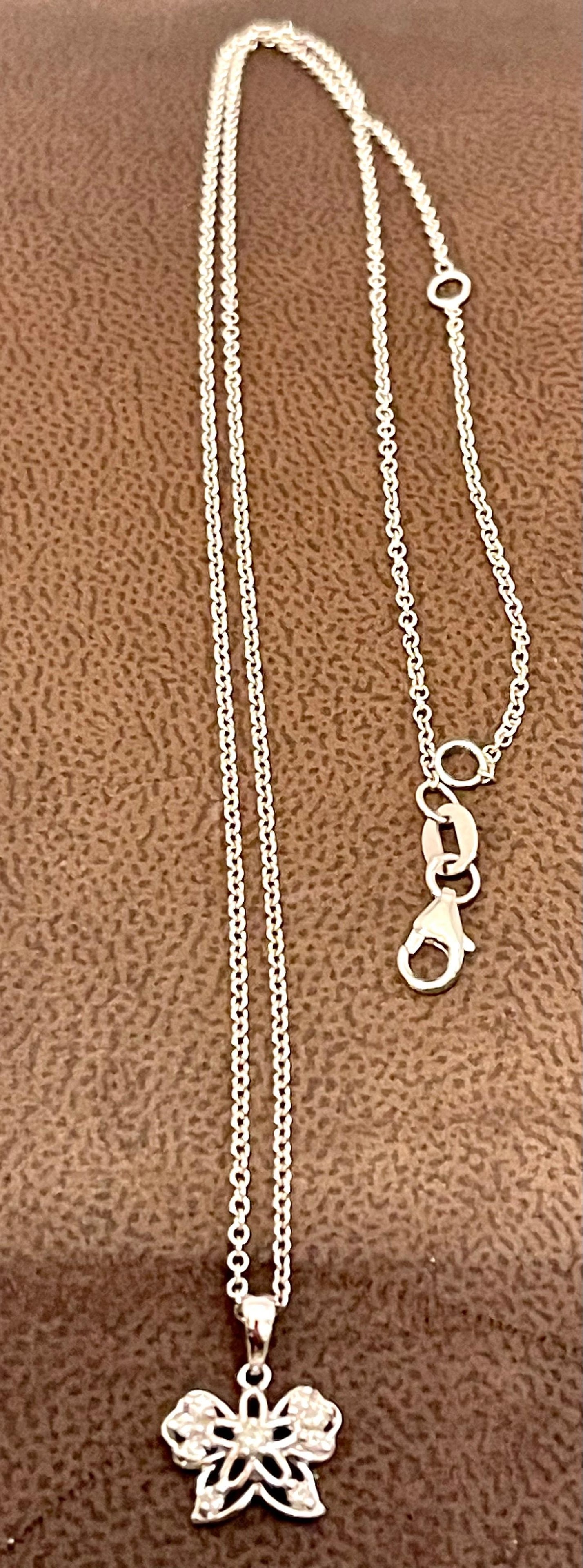 18 Karat Gold Butterfly Pendant with White Diamond & 14 Karat White Gold Chain - 12
