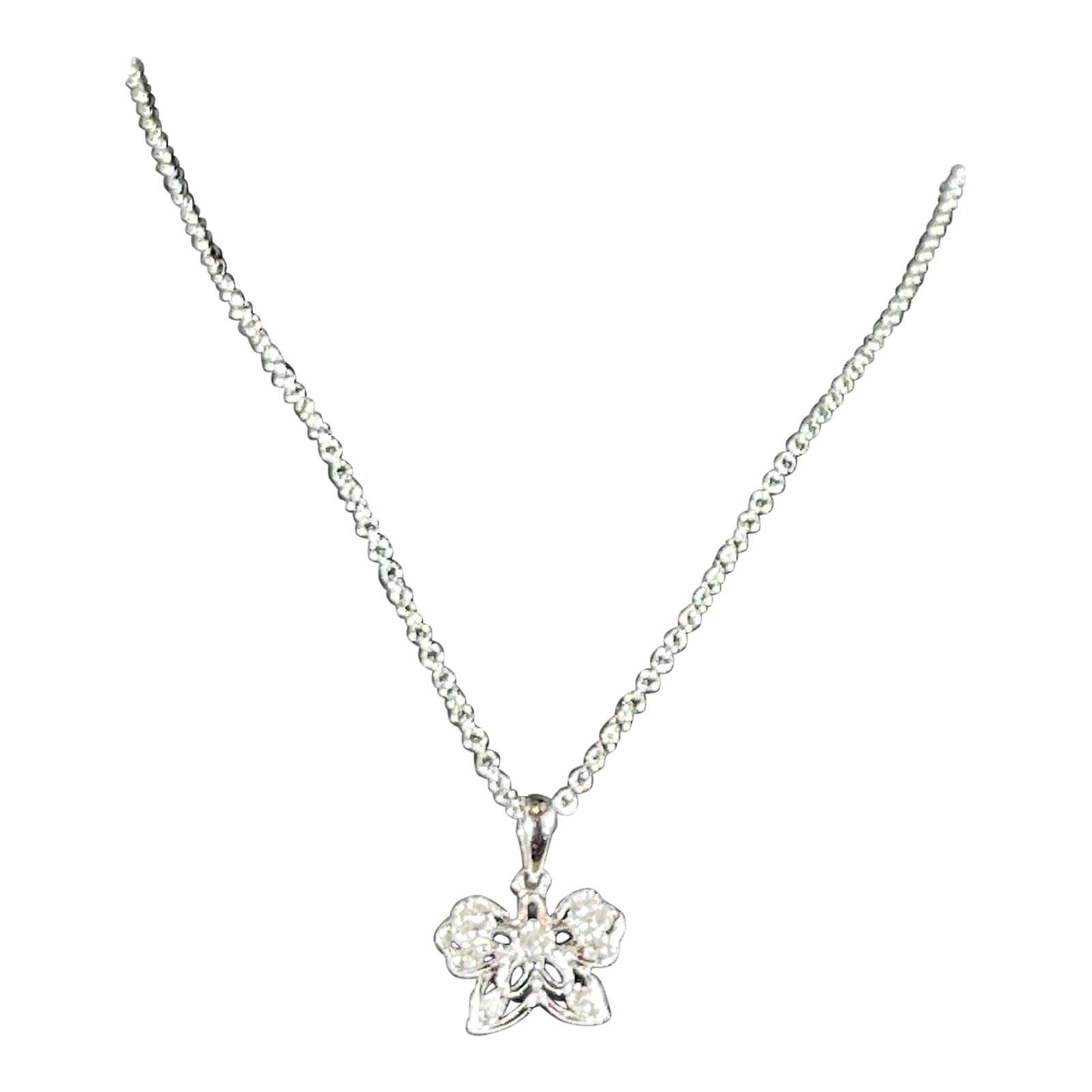 18 Karat Gold Butterfly Pendant with White Diamond & 14 Karat White Gold Chain: 18 Karat Gold Butterfly Pendant with White Diamond & 14 Karat White Gold Chain Very Delicate small butterfly with tiny diamonds in it , with a adjustable chain length to 16 or 18 inch long chain.