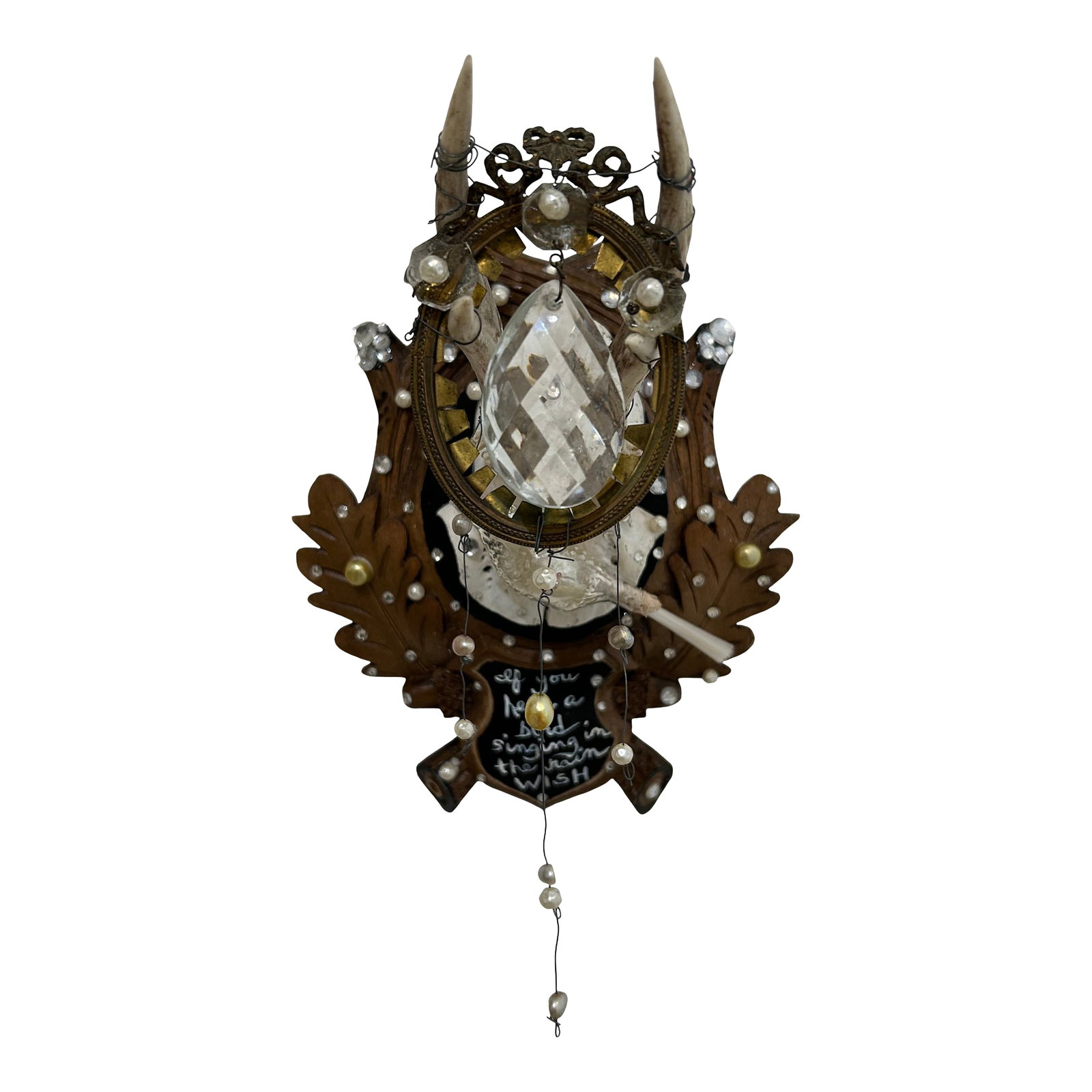 Black Forest Deer Skull Wall Sculpture: Wonderful found object wall sculpture that began as an antique Black Forest deer skull on plaque, transformed into a lovely work of art titled "Wish". A central vintage bird is surrounded by pearl
