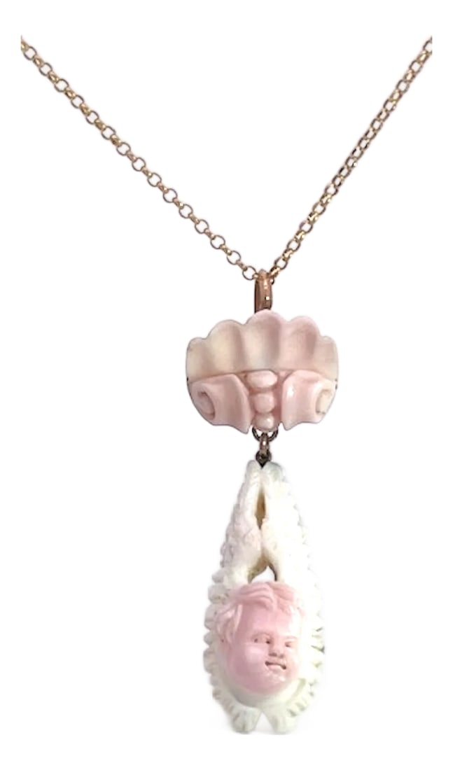 1930s Conch Shell Carved Pendant: This beautiful carved conch shell pendant is old probably circa 1930. It has a double swirl like flowers on the top and it drops to a gorgeous portrait of a cherub. The cherub is highly detailed and