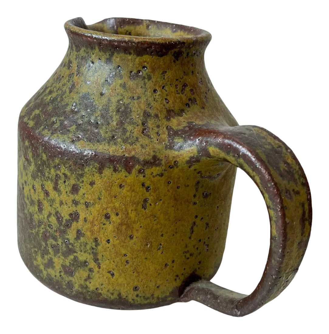 1960s Glazed Pitcher Ceramic Studio Art Pottery Style Doyle Lane: AMBIANIC presents Muted Yellow and Brown Glazed Pottery Jug after designs of Doyle Lane USA 1960s Crackling topography wonderful textured appearance. Artist signed, unclear signature. 6.25 D x 4.75 H