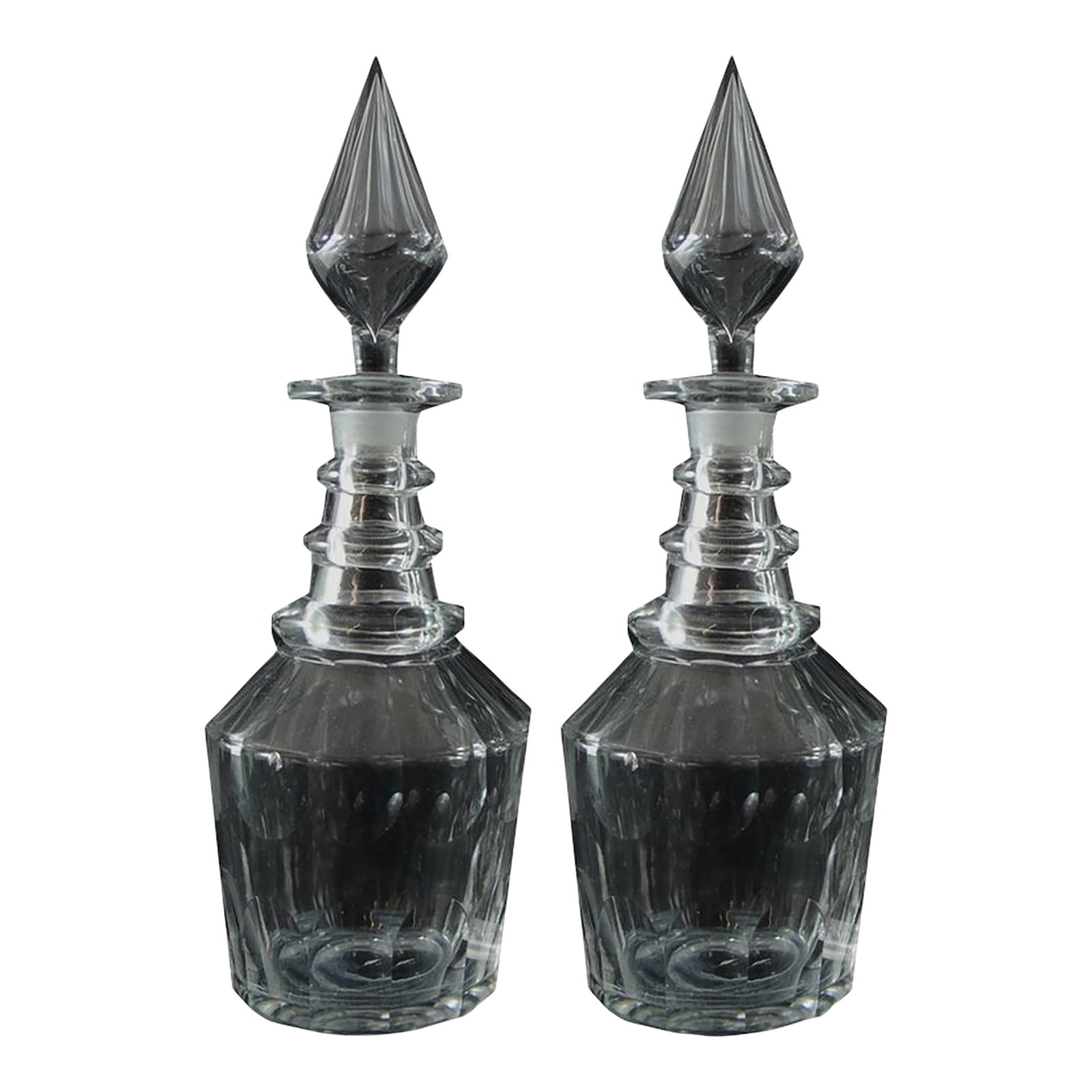 Pair of Georgian Style 19th Century Three Ring Glass Decanters with Spire Stoppe: Decanter: 9 in tall Base: 3.5 x 5 x 2.5 inches Stopper: 4 inches Stoppers are similar but one is bigger in size. Condition: Alterations: Original Condition Unaltered Imperfections: Some Imperfections