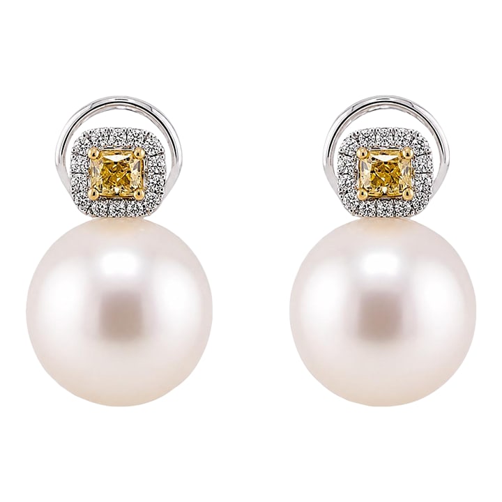 18k South Sea Pearl & Yellow DIamond Earrings, A Pair: 18k White gold earring with two 16mm South Sea Pearls and two natural yellow diamonds weighing 0.64 carats and round brilliant white diamonds weighing 0.23 carats Condition: Imperfections: No