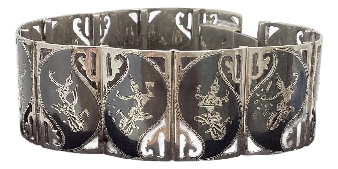 Vintage Siam Sterling Silver Panel-Link Bracelet: This is a Vintage Marked Siam (Thailand) Sterling Silver Bracelet linked with rectangular in shape engraved nielloware panels featuring traditional dancing figures on each link. Push-Lock closure