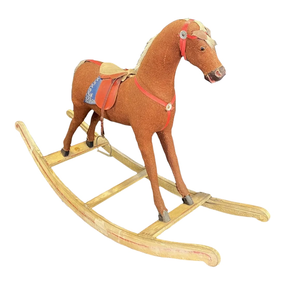 Folk Art British 19th Century Rocking Horse With Glass Eyes: Wonderful 19th century nursery rocking horse having charming detailed head with a dished face and flared nostrils. He retains his original saddle and leather stirrups and is mounted on a wooden base.