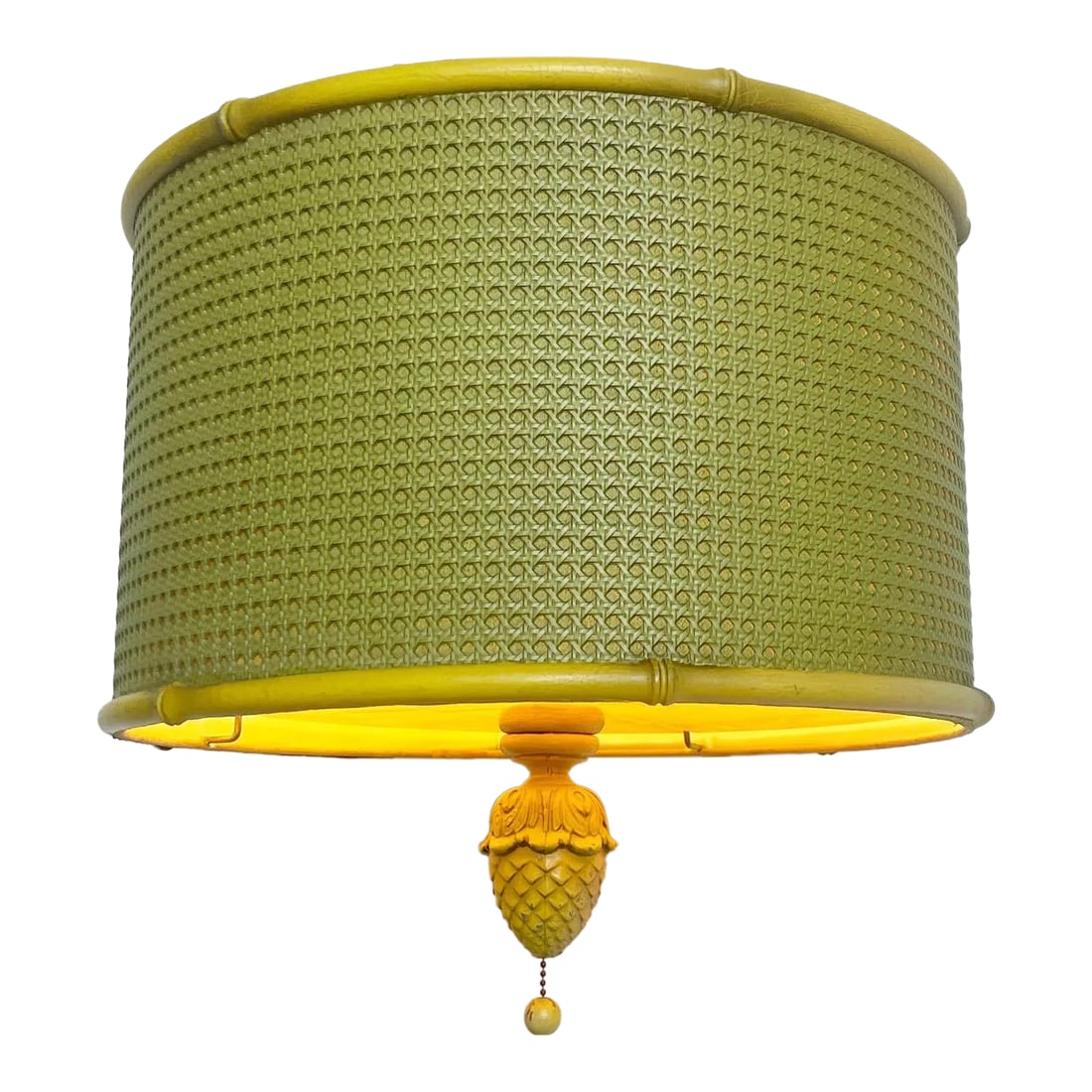 Regency Yellow and Green Cane Pineapple Pendant Lamp: Incredible vintage regency pendant light. Features a green cane side with a yellow faux bamboo frame. Beneath the lamp is shaded by a plastic with a miniature pineapple light switch. Chain is roughly