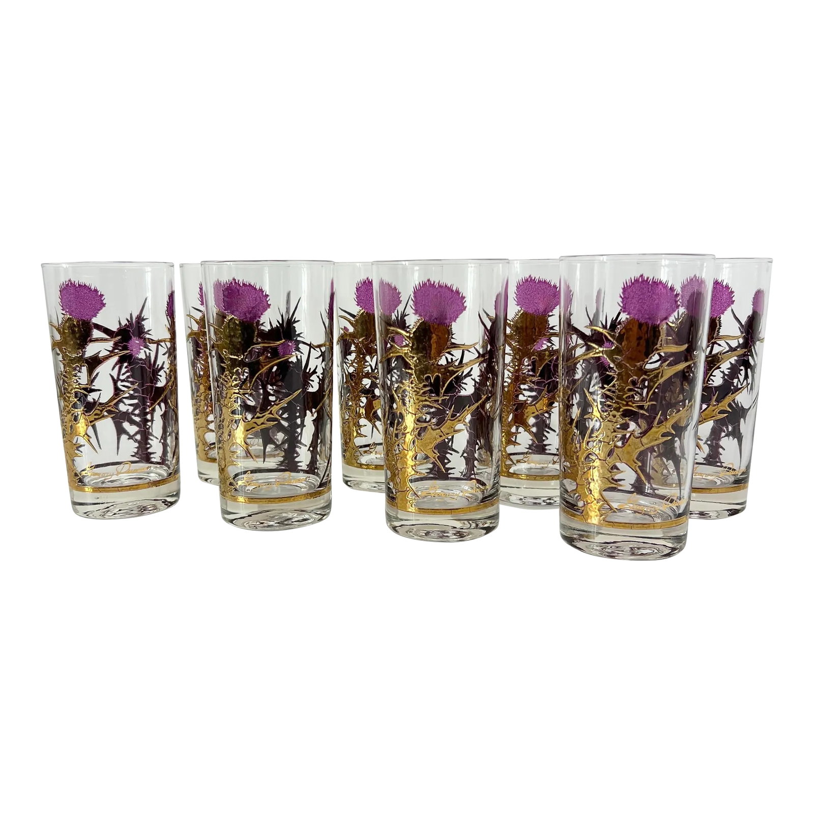 Mid Century 22k Gold Thistle Highball Glassware Set by Gregory Duncan - Set of 8: Stunning mid century modern glassware set by Gregory Duncan for West Virginia Glass. This set of 8 "Thistle" pattern glasses feature raised texture 22 karat gold stem with translucent purple enamel