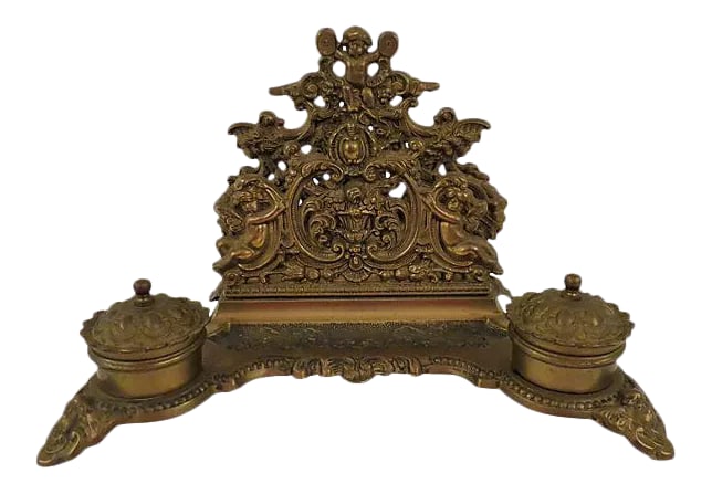 Antique French Louis XVI Style Bronze Double Inkwell and Letter Holder: Antique French bronze double inkwell ornately decorated with cherubs, removable bronze ink cups and lidded tops. Top rack for holding letters and center space for pen. Unmarked. Condition: