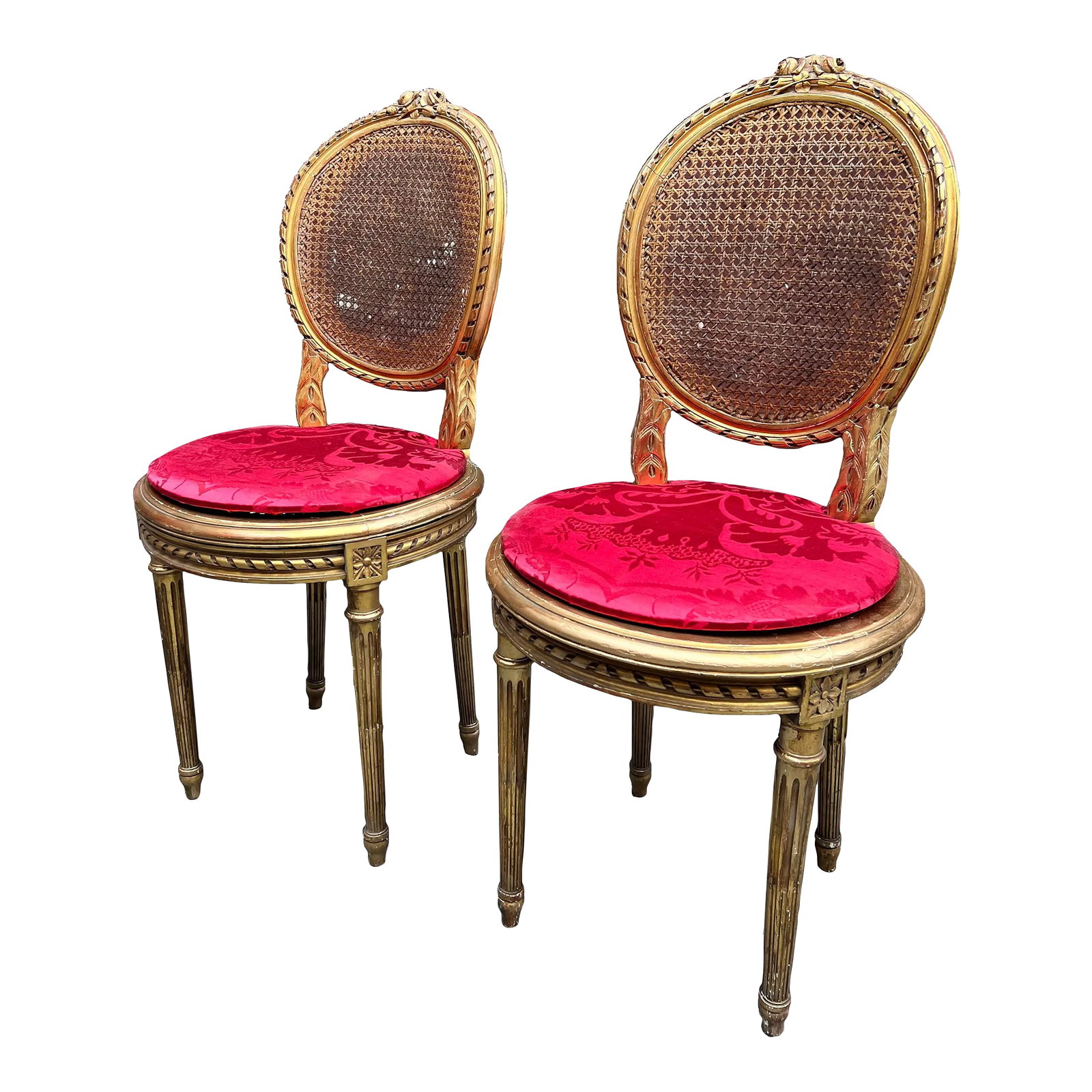 19th Century Pair of Louis XVI Giltwood Side Caned Chairs: 19th Century Antique French Louis XVI Style Gold Giltwood and Cane Side Chair. Item features gold gilt finish, cane back and seat, solid wood frame, distressed finish, nicely carved details, tapered