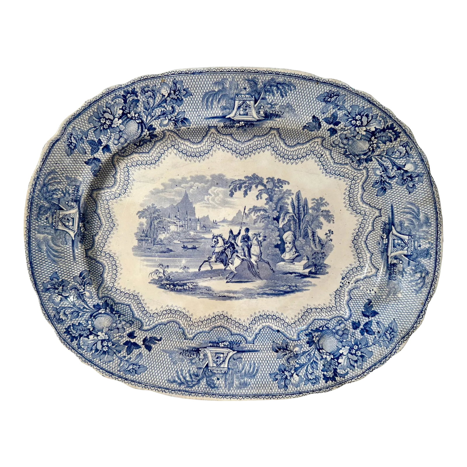 Staffordshire Blue Transferware Meat Platter: A military scene Staffordshire transferware meat platter. Blue and white with marking on back. Circa 1890s, England. Condition: Alterations: Original Condition Unaltered Imperfections: Some