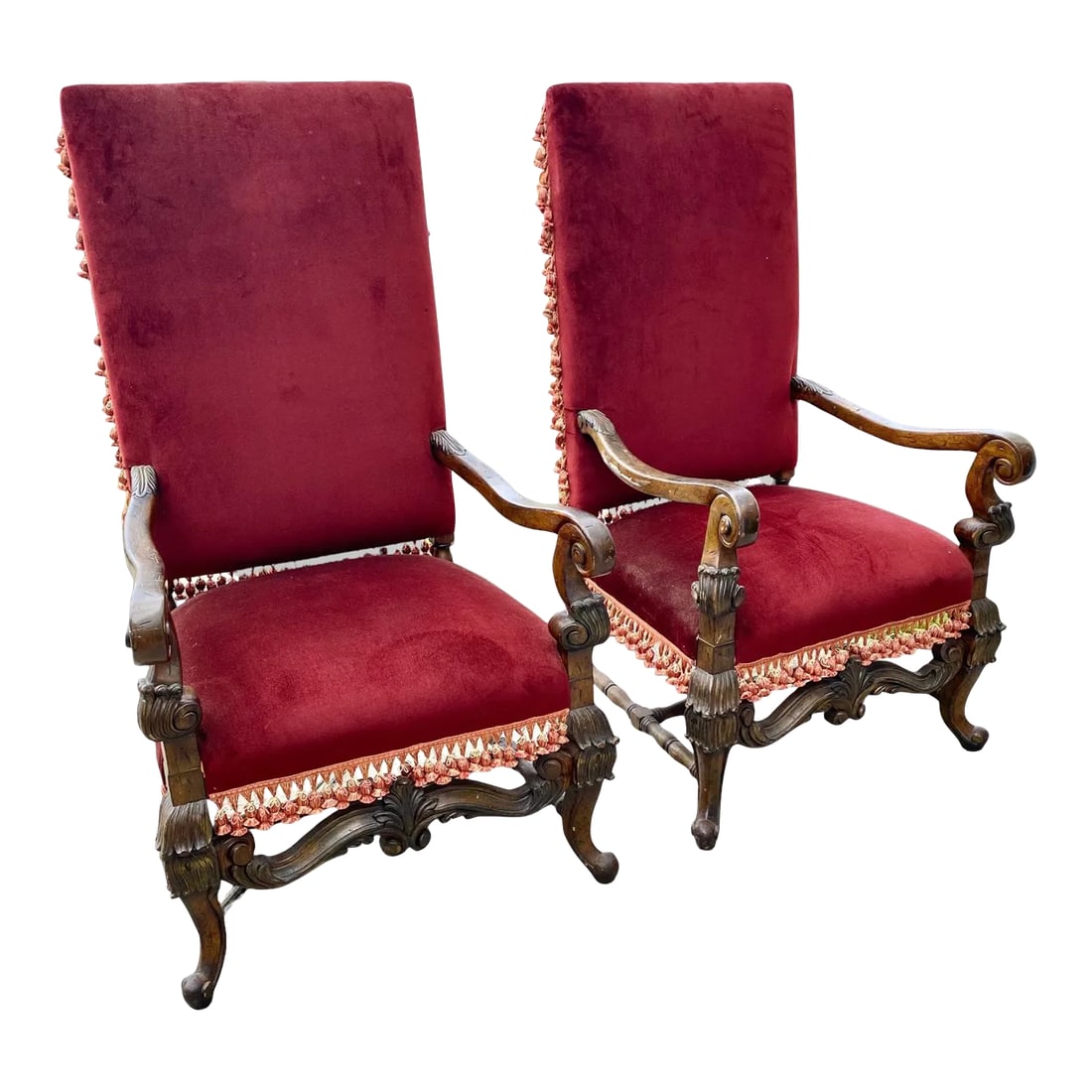Pair of Vintage French Louis XIII Fauteuils, Armchairs: Pair of carved French Louis XIII style Fauteuils or armchairs, with gracefully scrolled arms, high backs and generous seats (and seat heights of 20") resulting in uncommon comfort. The lower apron