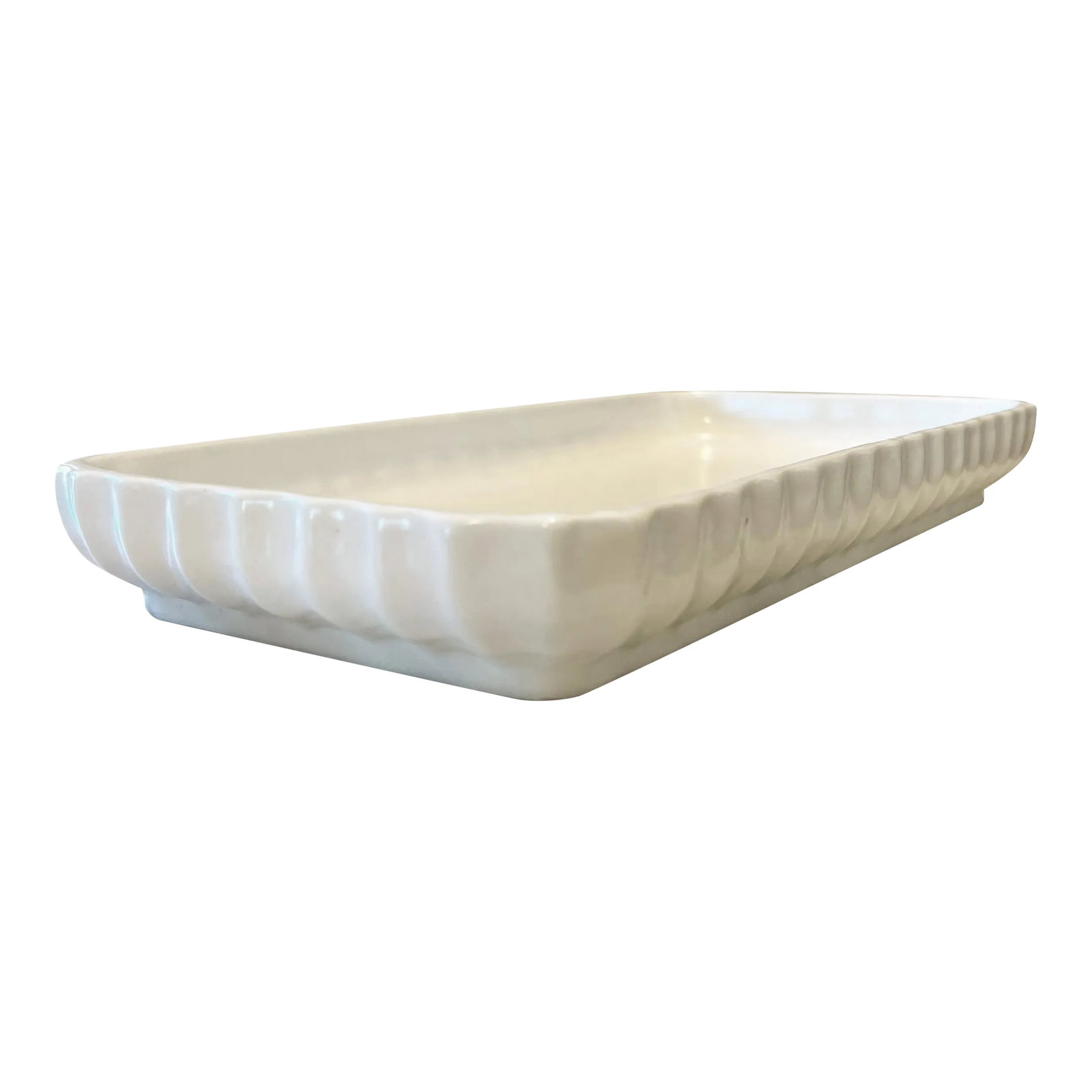 Vintage Waterworks Scalloped Ceramic Tray: A vintage soft ivory-white ceramic tray in a matte finish, by Waterworks. This unique tray has a feminine curved scalloped-edge detailing and a sleek plinth base. It's reminiscent of French Art-Deco d