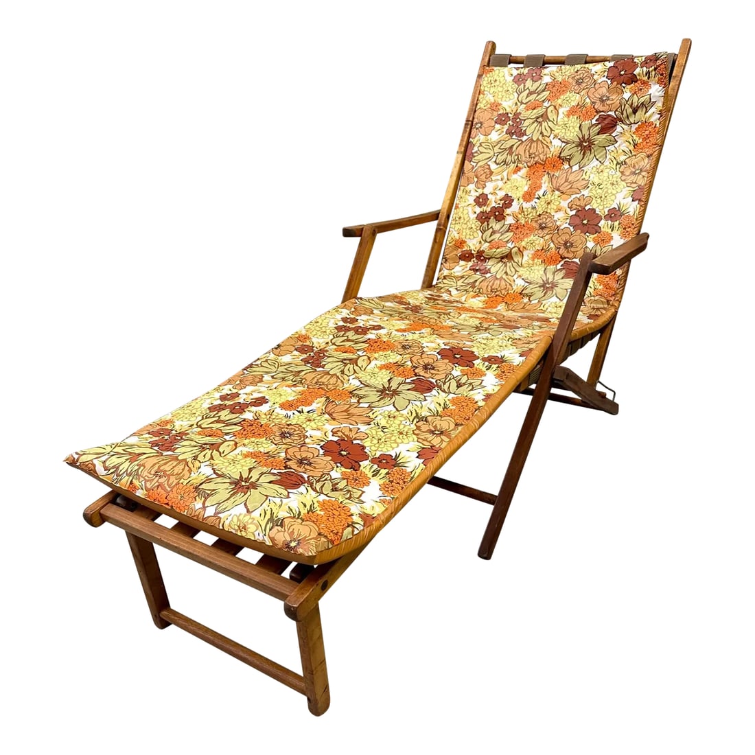 Teak Steamer Ship Lounge Deck Chair | 1950s: Vintage steamer ship chair in the style of the 1st class deck chairs. Folding chair is adjustable to 3-positions. Teak wood frame and detachable footrest. Original vinyl cushion in a floral pattern.