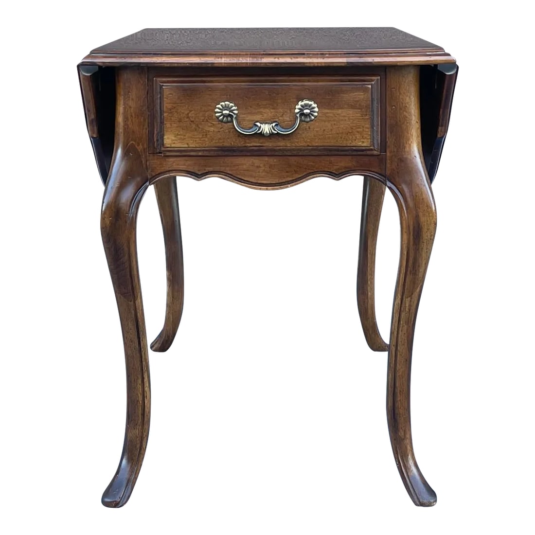 1980s Ethan Allen Country French Birch Drop Leaf Side Table With Drawer (26-8302 Fruitwood): A late 20th century Ethan Allen Country French collection drop leaf oval side table with one drawer in their golden brown Fruitwood finish. American made. Circa 1988. The top measures 19" wide with th