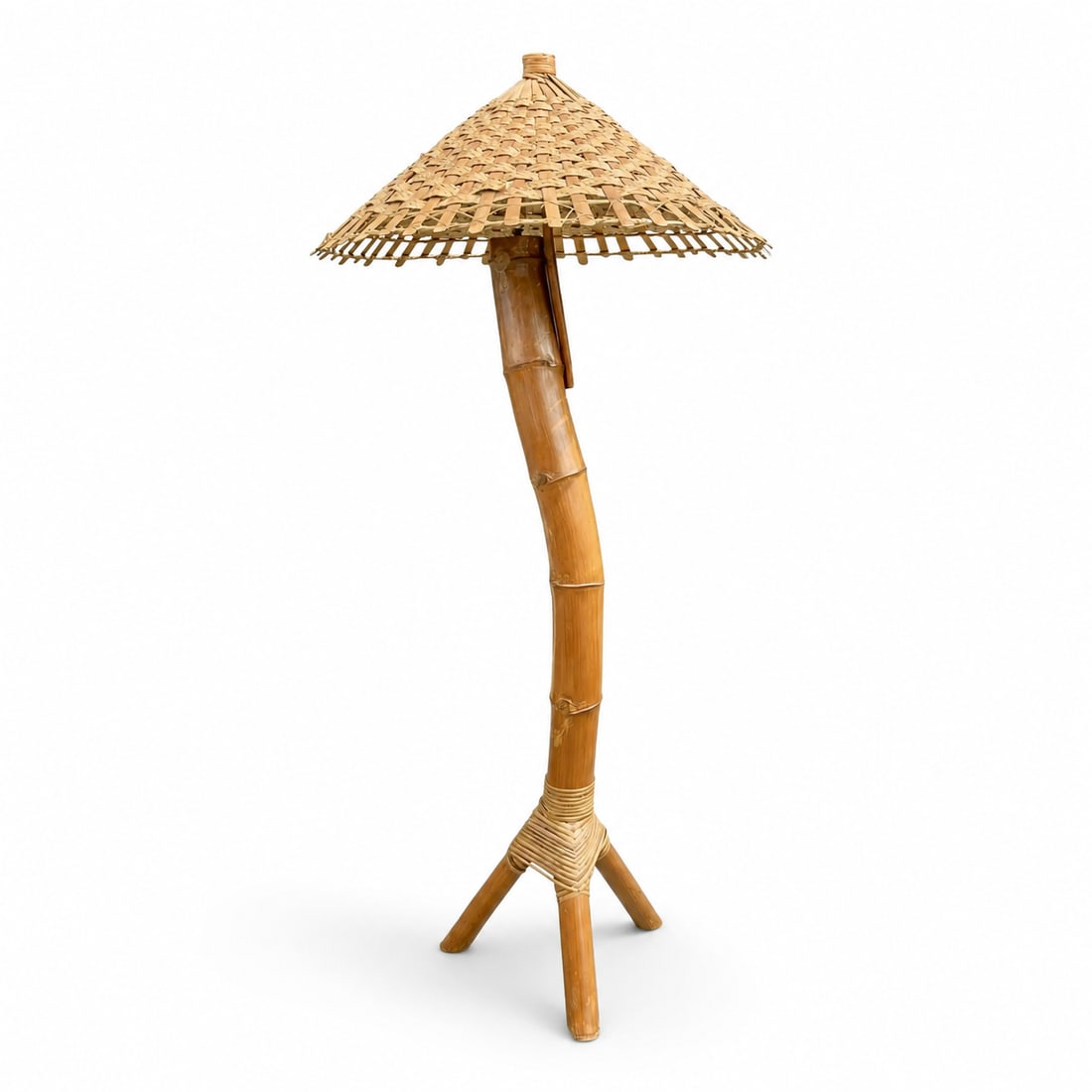 1970s Monumental Coastal Bamboo Floor Lamp: Vintage 1970s monumental coastal bamboo floor lamp. This is a unique, solid piece of curved bamboo, weaved with wicker to hold a tripod base of bamboo cuts. Come with a fully wrapped, wicker shade.