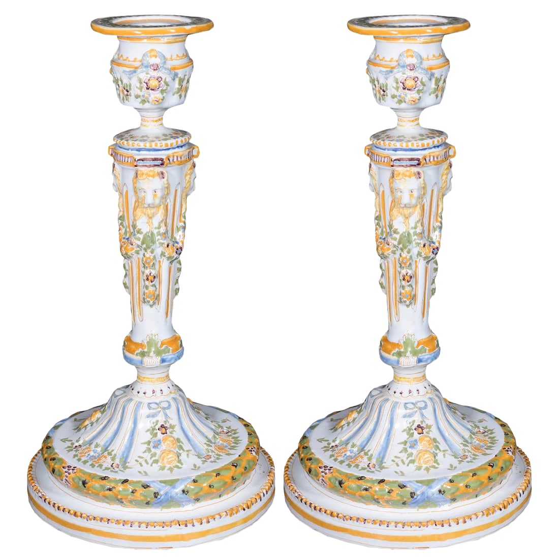 19th Century Vintage French Faience Candle Holders- A Pair: A fine pair of French faience Louis XVI Style candlesticks. Each decorated with delicate floral blossoms and vines. Condition is excellent. Circa: Nineteenth Century Condition: Alterations: Original