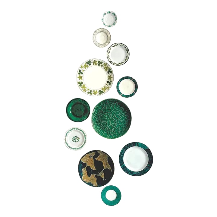 Green and White Mid-Century Wall Plate Curation - Group of 11: Mixed green decorative plates, group of 10. This eye-catching set of decorative plates includes styles and designs from multiple countries over multiple 20th century eras. Conversation starters that m