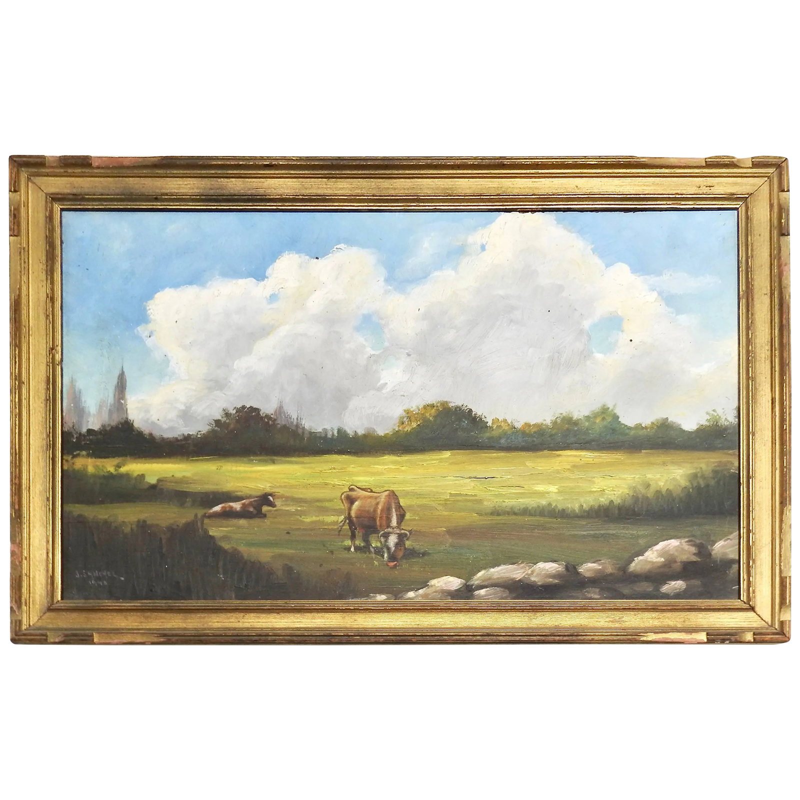 Midcentury Signed Painting on Board J. Sanchez, 1949: Fluffy clouds in the blue sky are hovering over the cattle in the colorful field of grass. Trees line the background and there are some rocks in the front. The painting is signed by J. Sanchez and