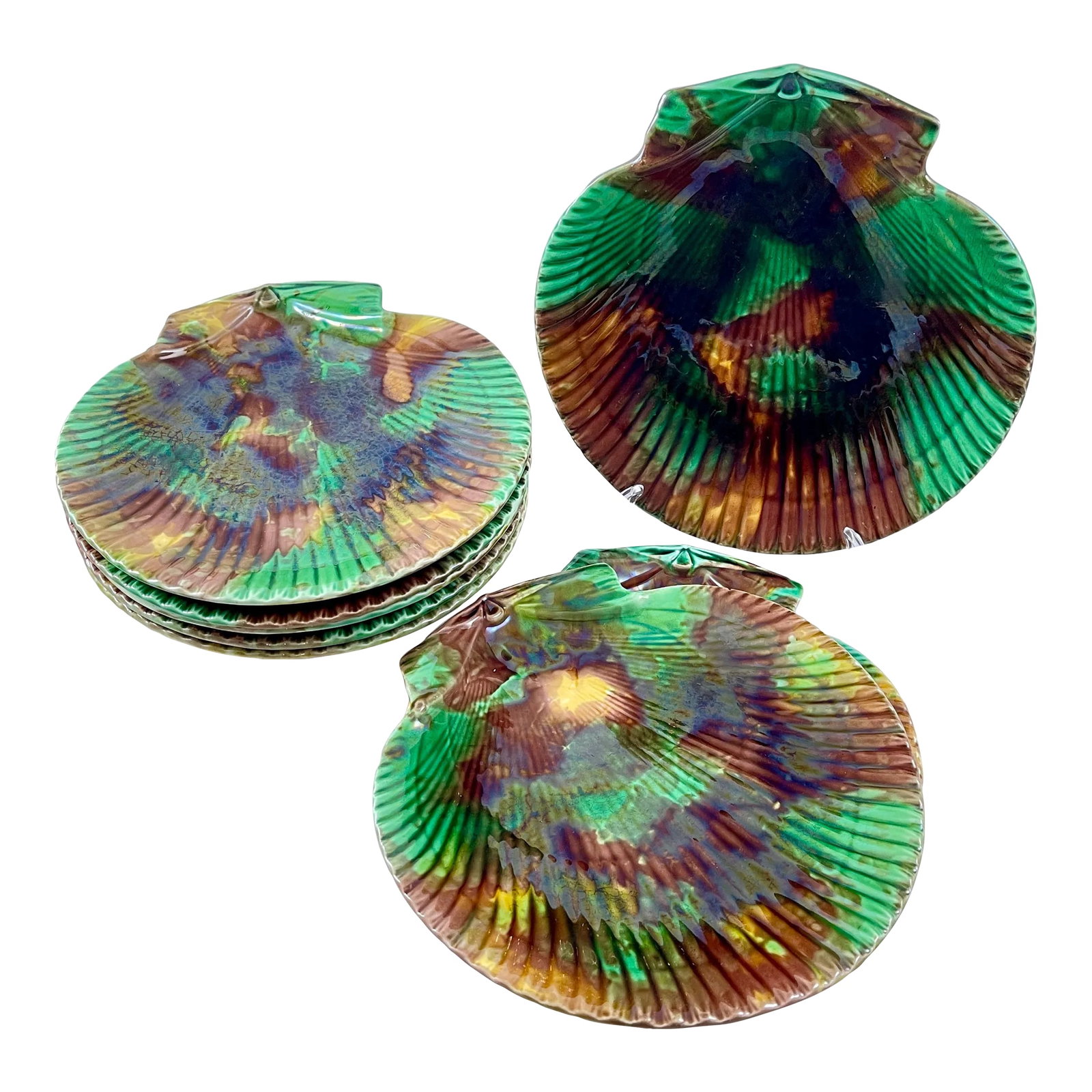 Wedgwood Majolica Tortoiseshell Seafood Plates, Set of 8: From Wedgwood, an assembled set of eight English majolica scallop shell shaped, mottled tortoiseshell glazed seafood salad plates. Each plate shows a variation of the tortoiseshell glazing of green,