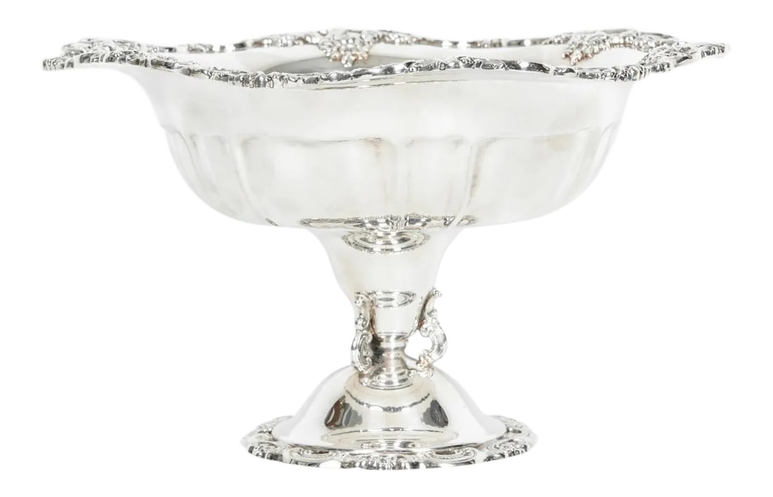 Vintage Silver Plate Fruit Bowl Piece: Vintage silver plate baroque fruit bowl piece or table centerpiece. The fruit bowl piece is in excellent condition, maker's mark undersigned. The piece measure about 11 inches diameter x 6 inches tall
