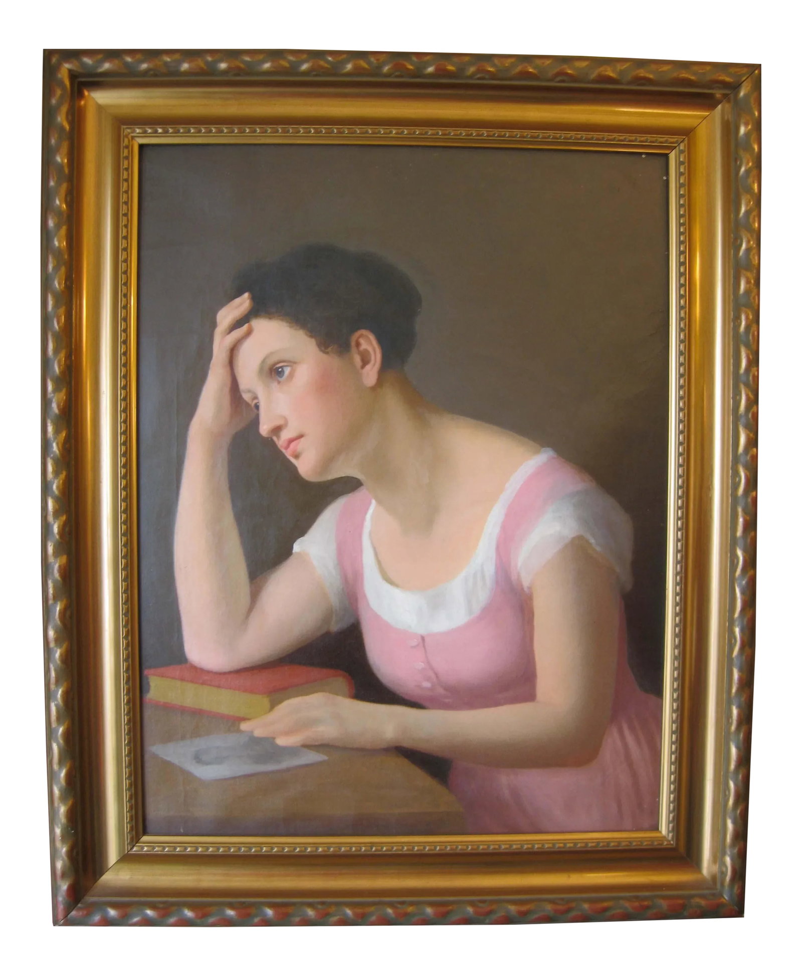 19th C. Portrait of Pensive Young Woman Painting: 19th-century portrait of a pensive young woman. The woman featured in the painting is contemplating an image of a young man on her desk. Painted in oil on canvas Unsigned Professionally framed in a