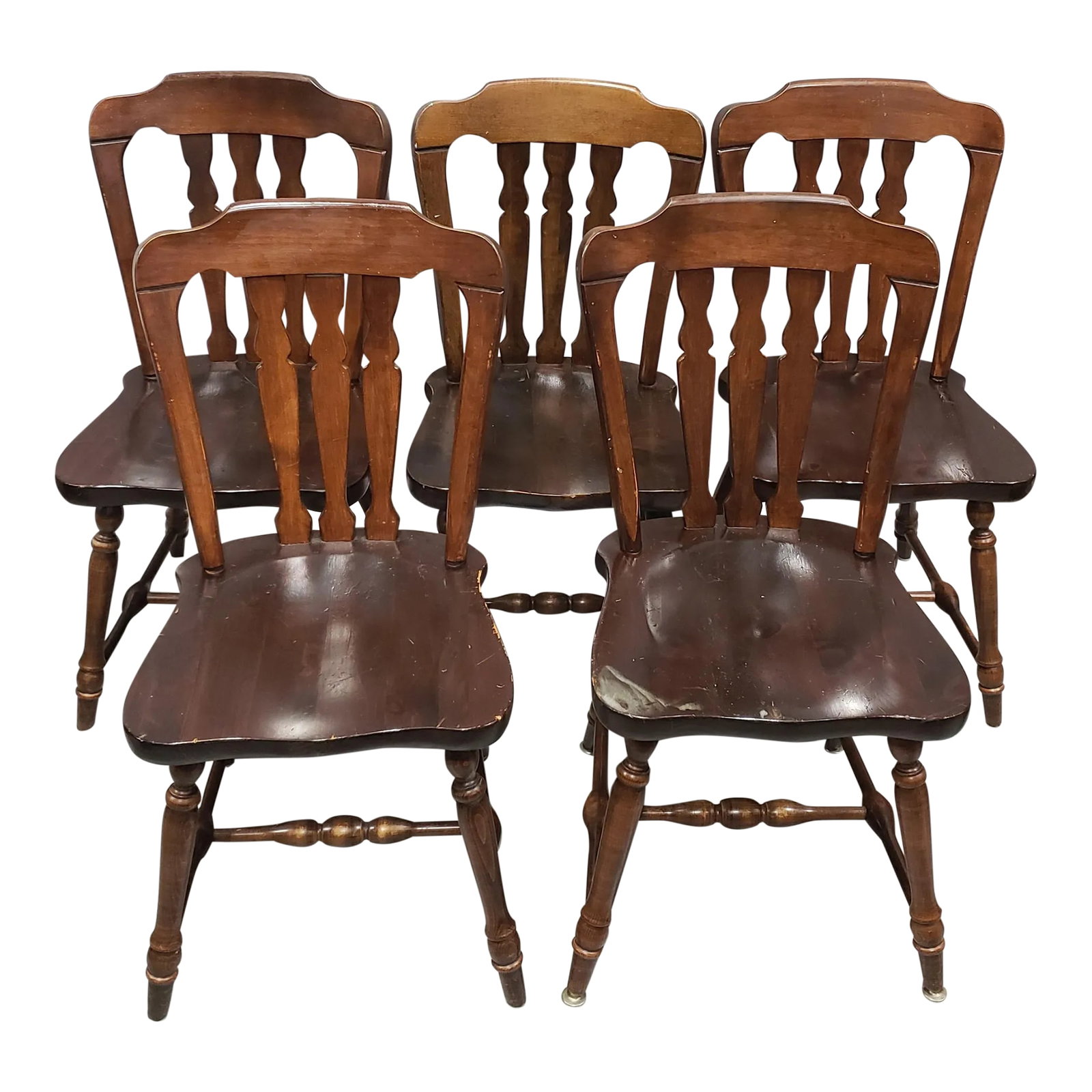 Mid 20th Century Dark Stained Wooden Walnut Ethan Allen Lath Back Kitchen Chairs - Set of 5: This set includes 5 charmingly rustic Ethan Allen dining chairs. Each is stained a dark walnut to complement the grain of the solid wood. The lath backs make these chairs comfortable and stylish, with