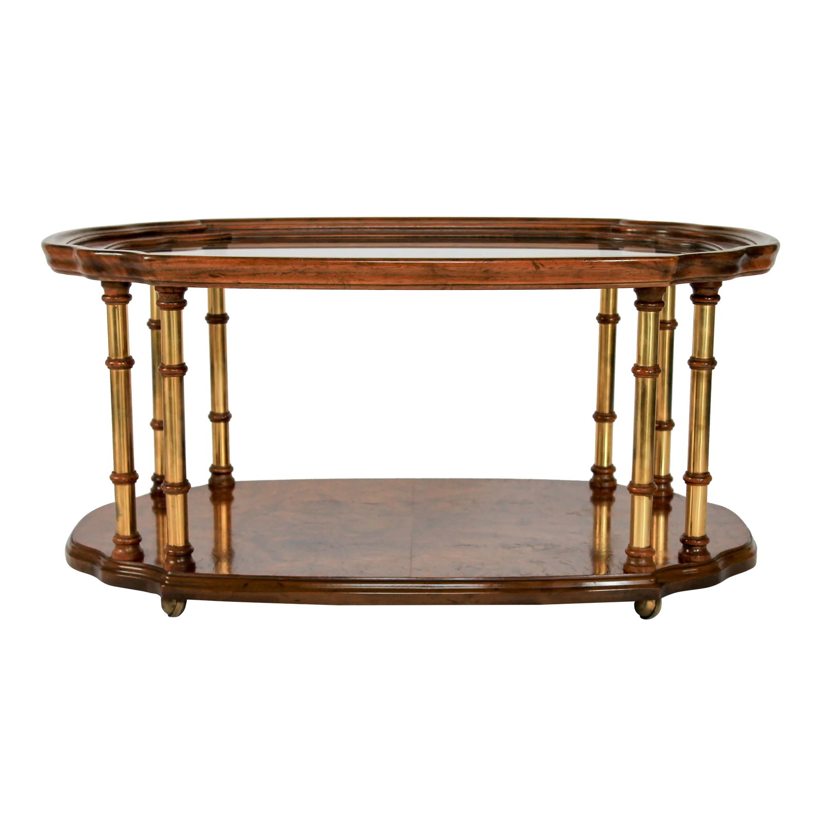 Mid-Century Burlwood and Brass Coffee Table by Drexel Heritage: Mid-century burled elm wood veneer cocktail table with scalloped edges and lightly smoked glass on brass castors. Made by Drexel Heritage. Some light scratches on glass. Light wear to wood. Patina to