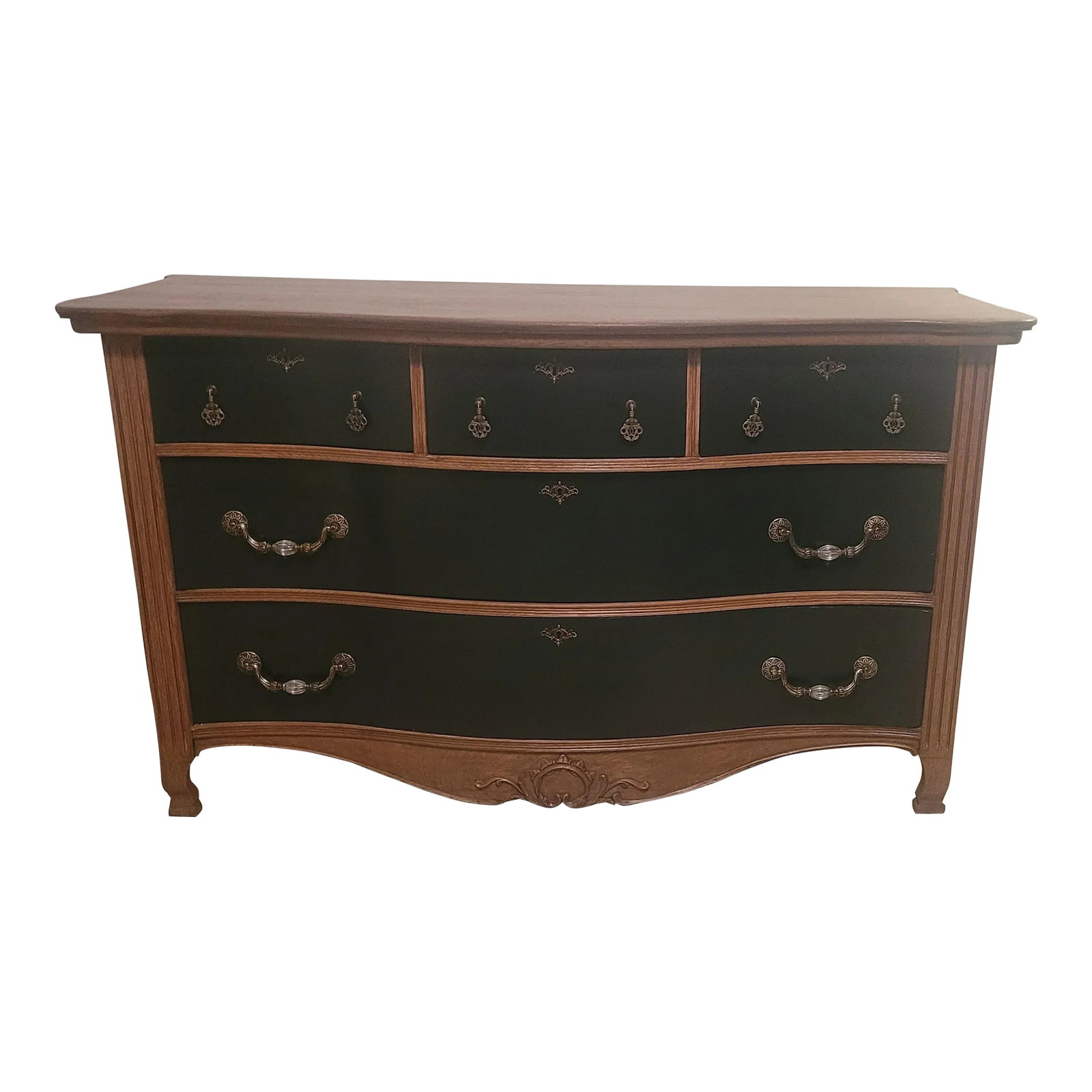 Mid 19th Century Oversized Tiger Oak Serpentine Front Dresser: This oversized antique tiger oak dresser is a true statement piece. Completely refinished, it boasts striking ink blue drawer fronts, accented by classic hardware. The graceful serpentine front and