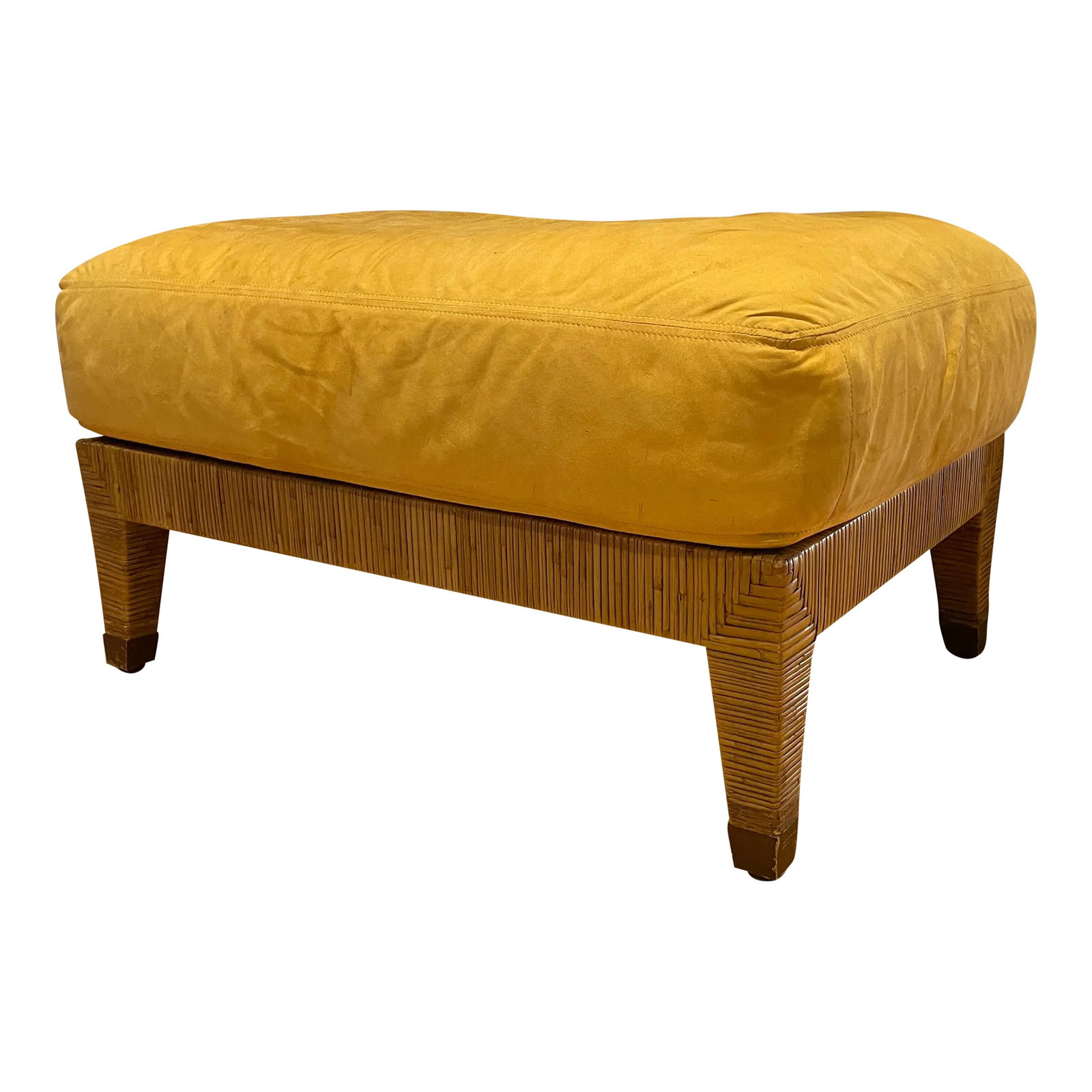 1970s Vintage McGuire Rattan Wrapped Upholstered Ottoman: Coastal chic vintage McGuire Rattan wrapped upholstered ottoman. Features brass feet and microfiber attached cushion. Rattan wrapped legs and sides. Upholstery has slight staining and would benefit